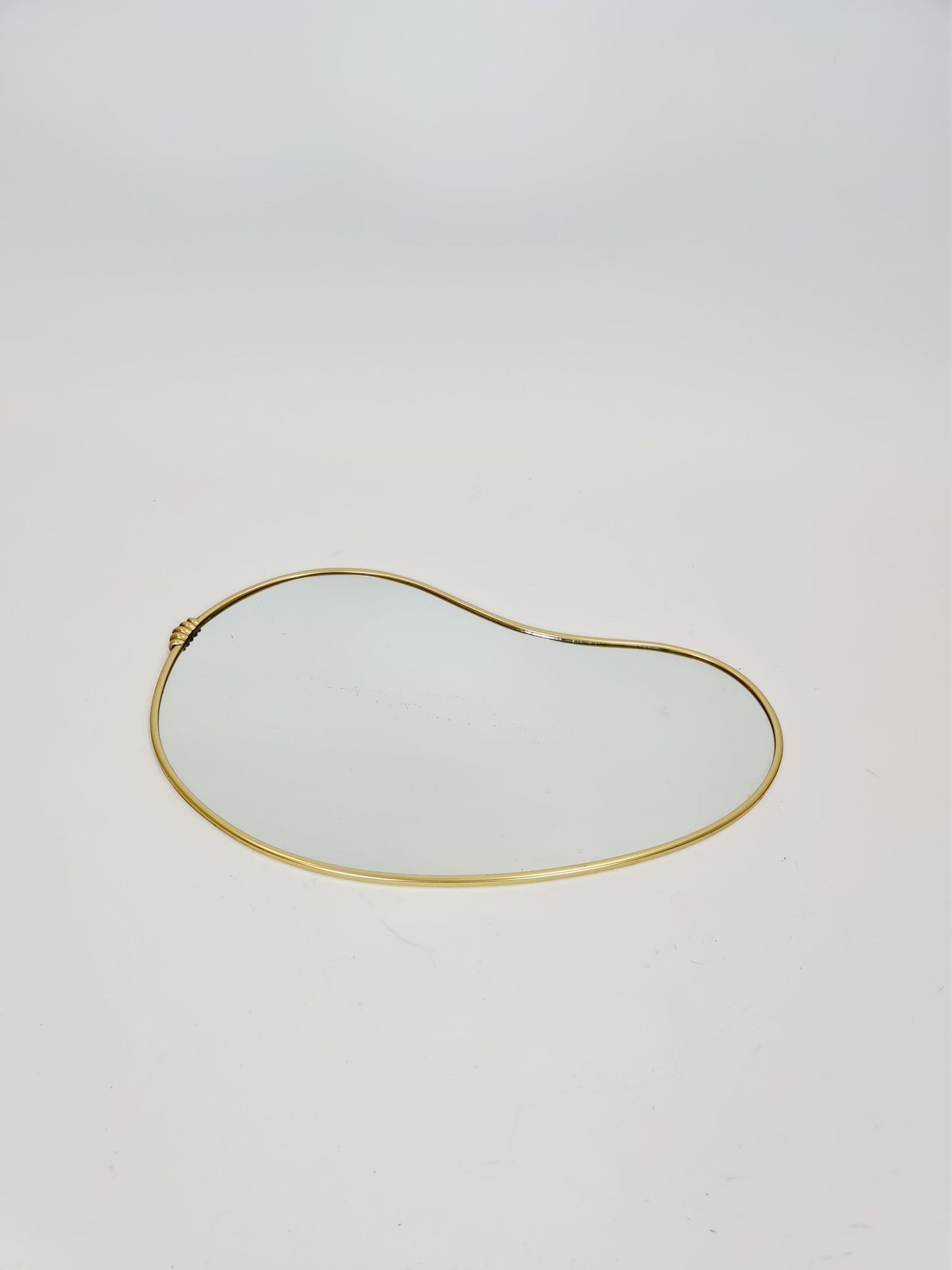 Mid Century asymmetric German brass Original kidney wall mirror from the 60s