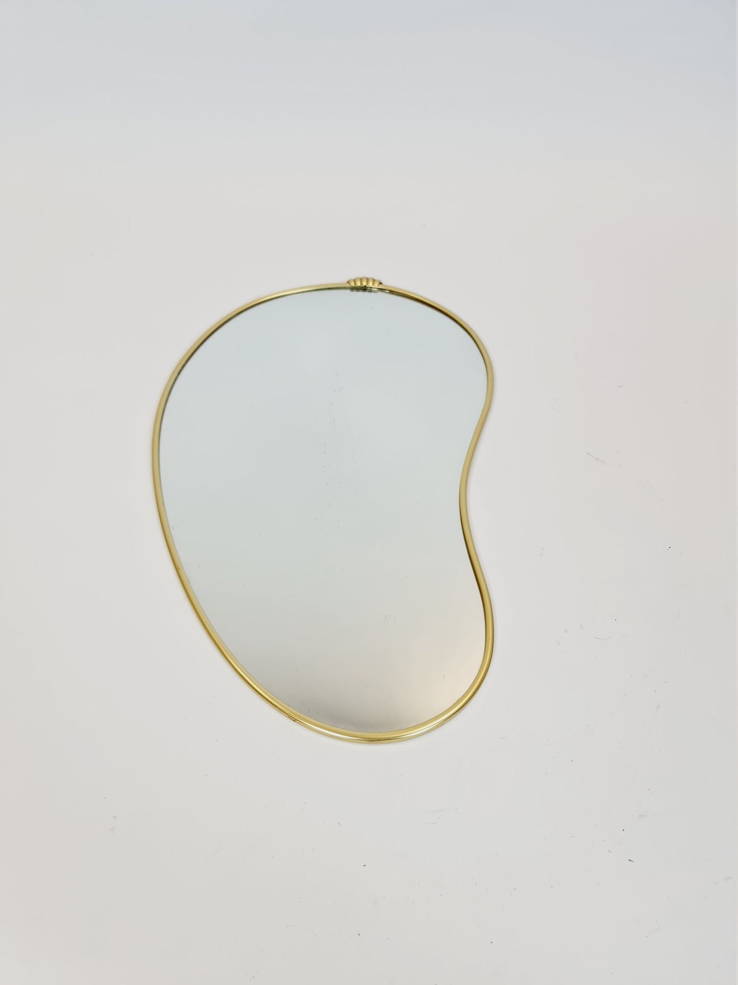 Mid Century asymmetric German brass Original kidney wall mirror from the 60s