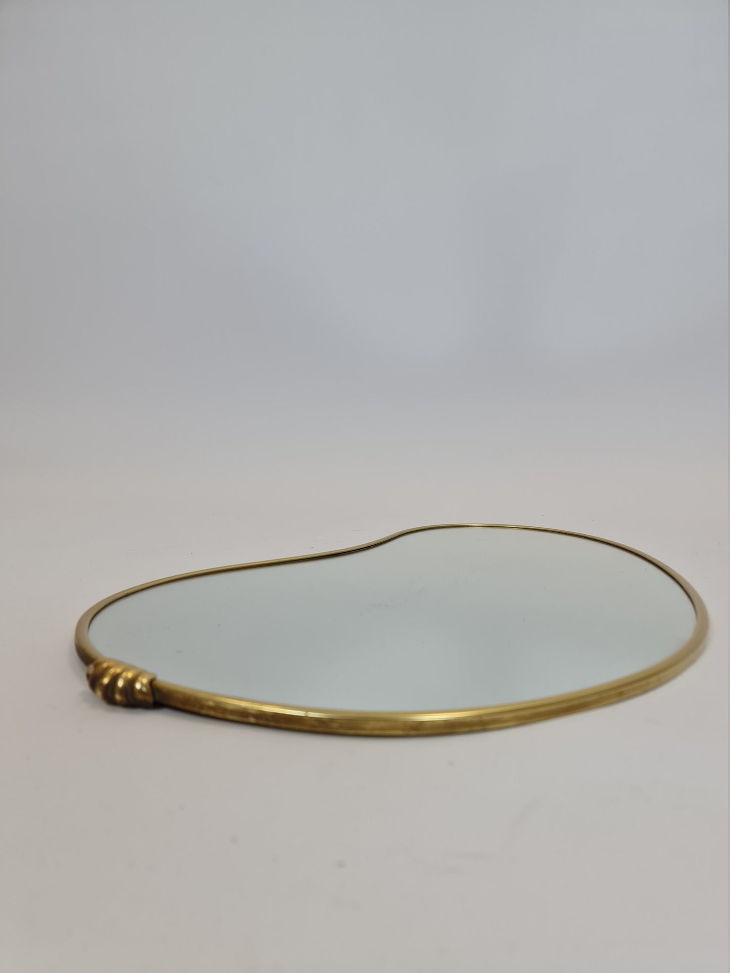 Mid Century asymmetric German brass Original kidney wall mirror from the 60s