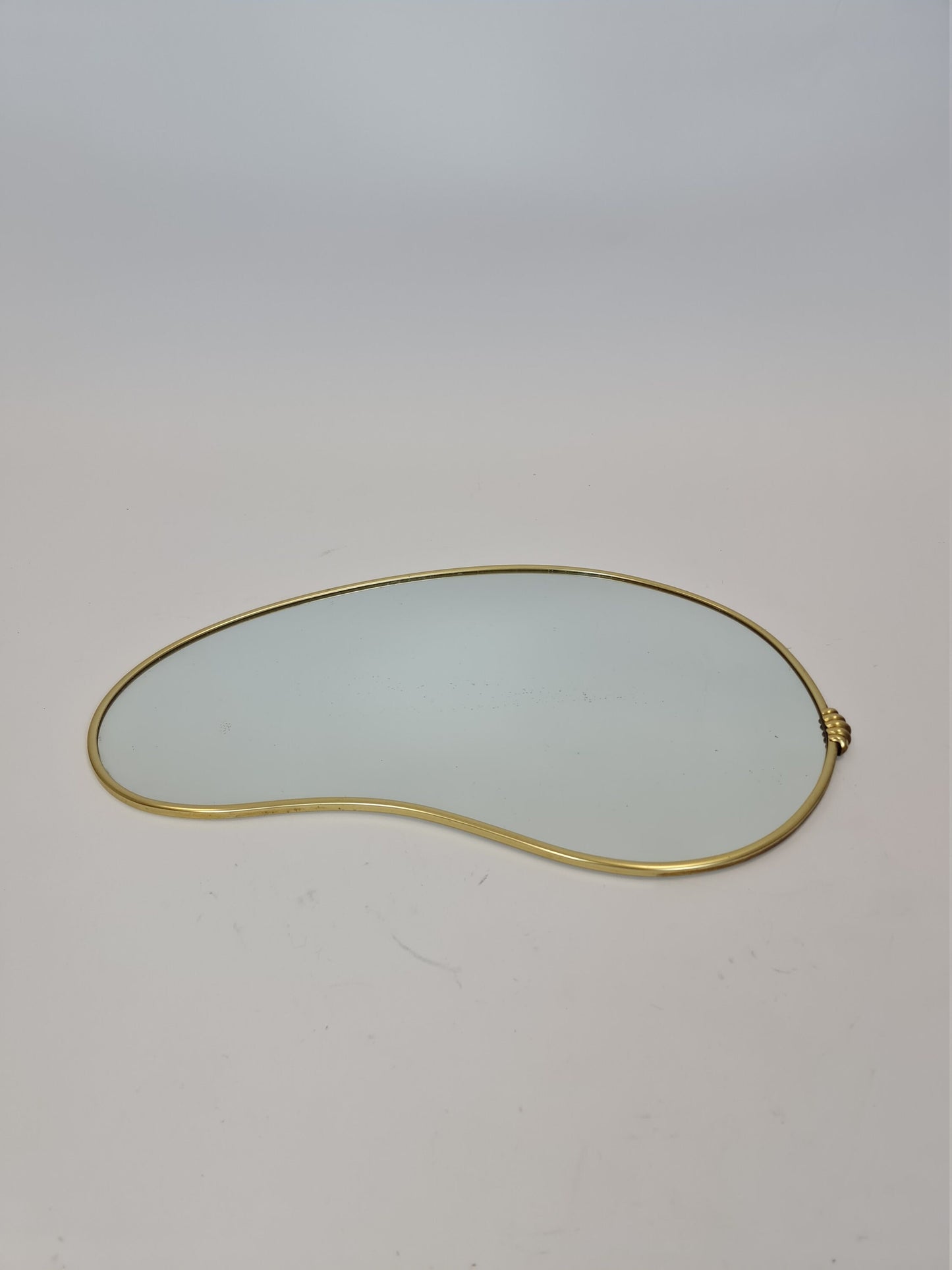 Mid Century asymmetric German brass Original kidney wall mirror from the 60s