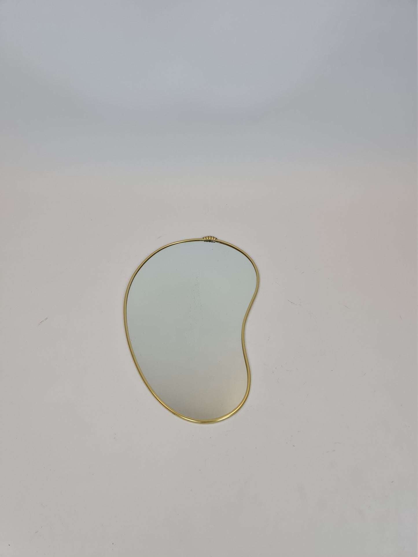Mid Century asymmetric German brass Original kidney wall mirror from the 60s