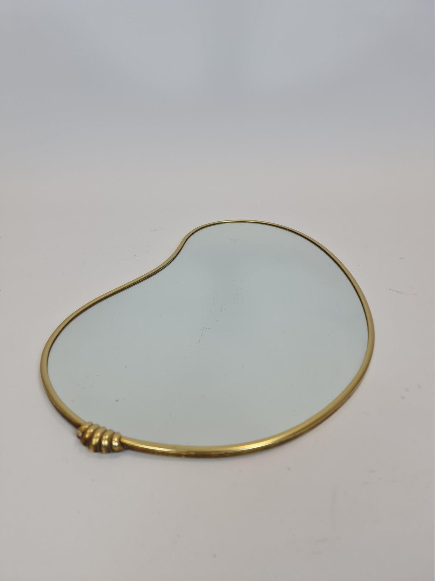 Mid Century asymmetric German brass Original kidney wall mirror from the 60s