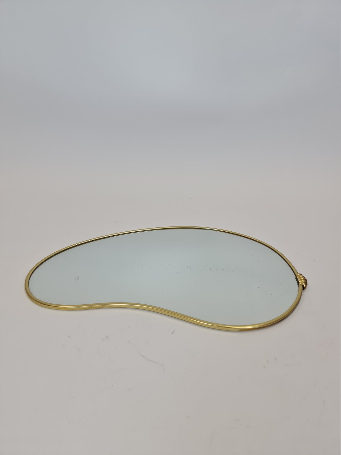Mid Century asymmetric German brass Original kidney wall mirror from the 60s