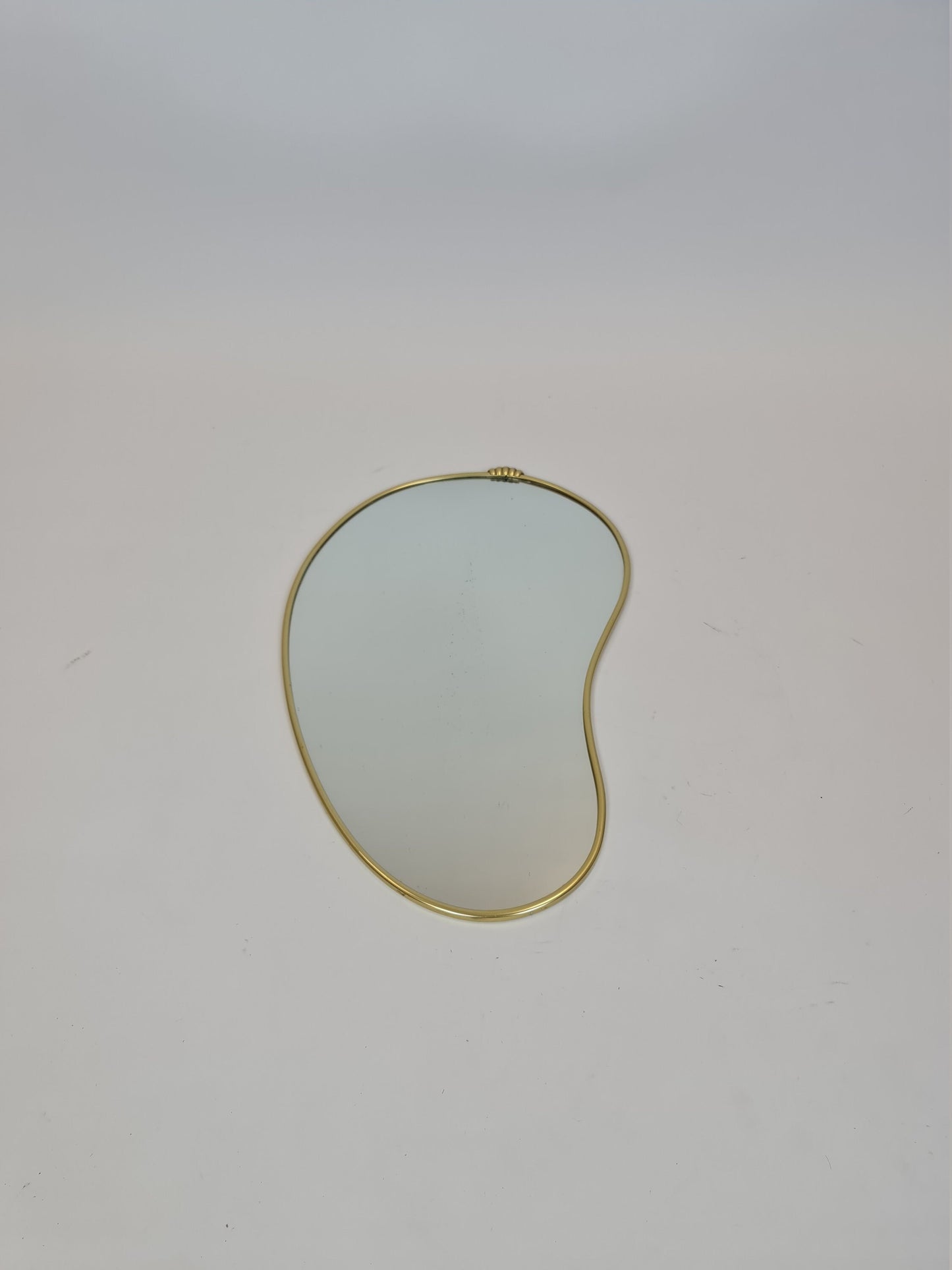 Mid Century asymmetric German brass Original kidney wall mirror from the 60s