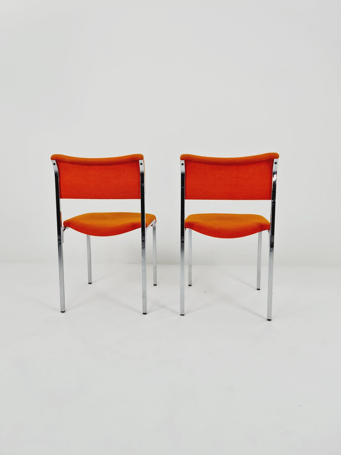 Set of 2 orange girsberger eurochairs, space age design 1970s