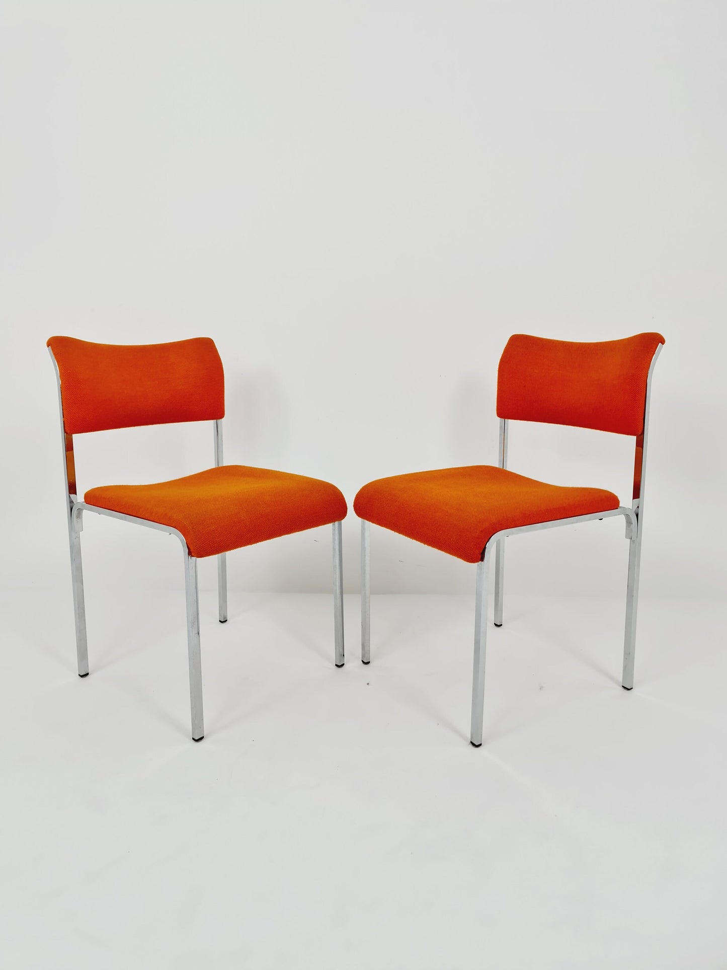 Set of 2 orange girsberger eurochairs, space age design 1970s