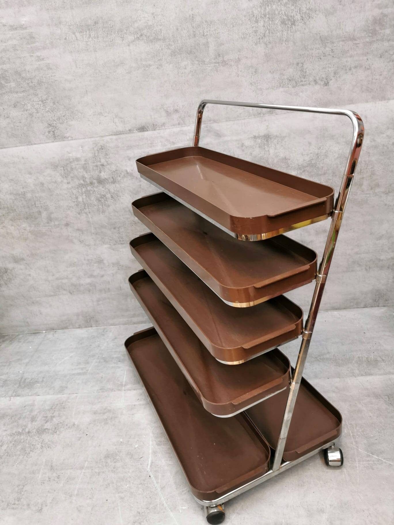Space age flower or storage shelves unite on casters Italy 1980s