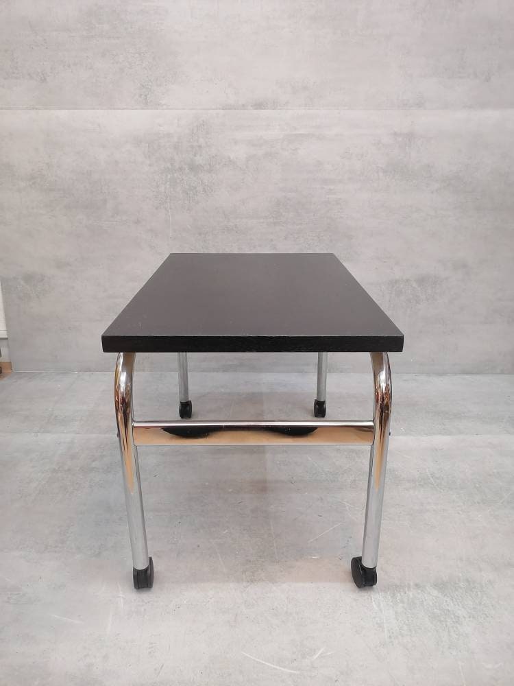 Mid-century modern Bauhaus design coffee table on wheels. 1980s Italy
