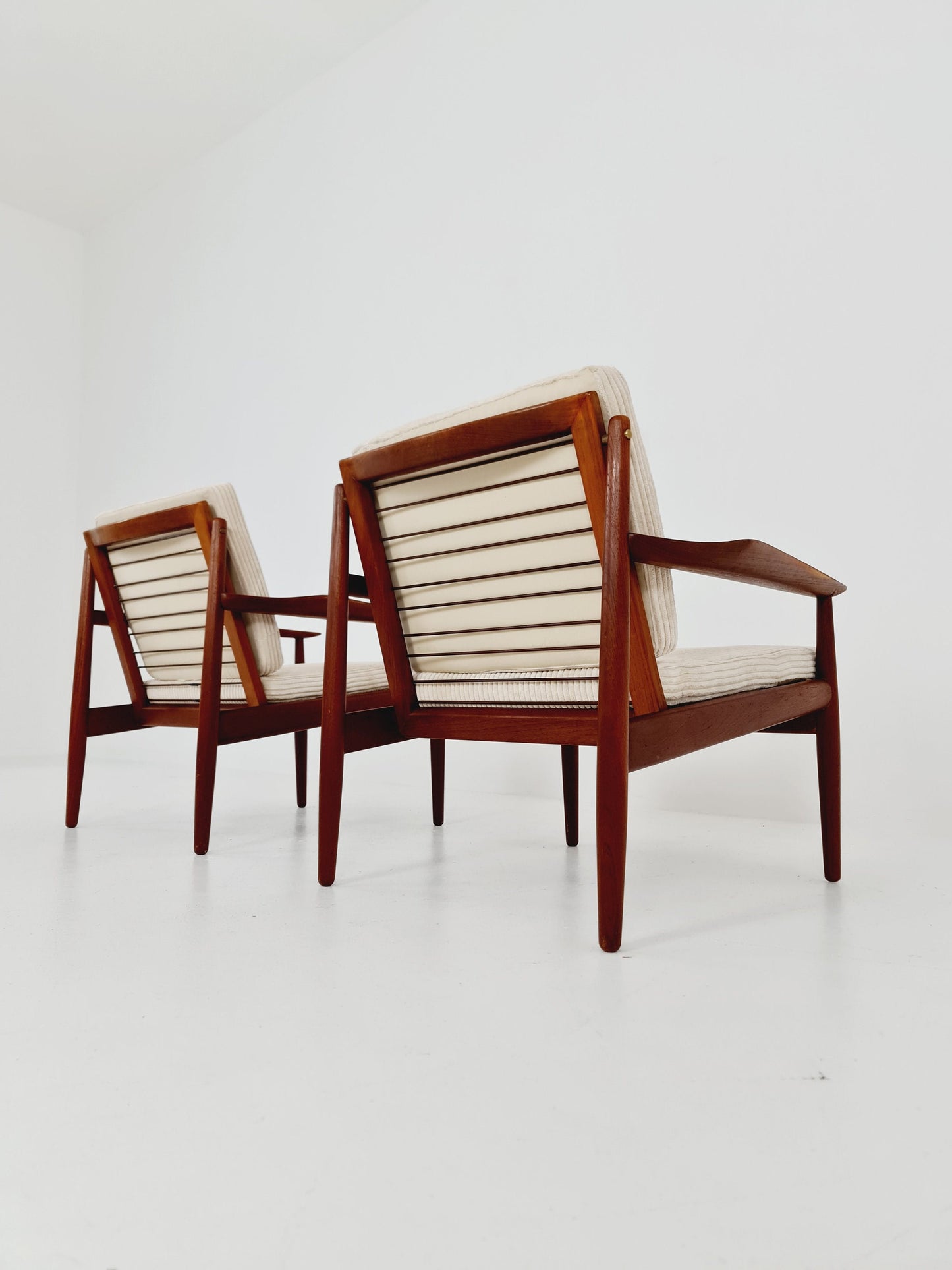 Mid century easy lounge chairs by Grete Jalk, Denmark, teak & brass, 19560s, Set of 2