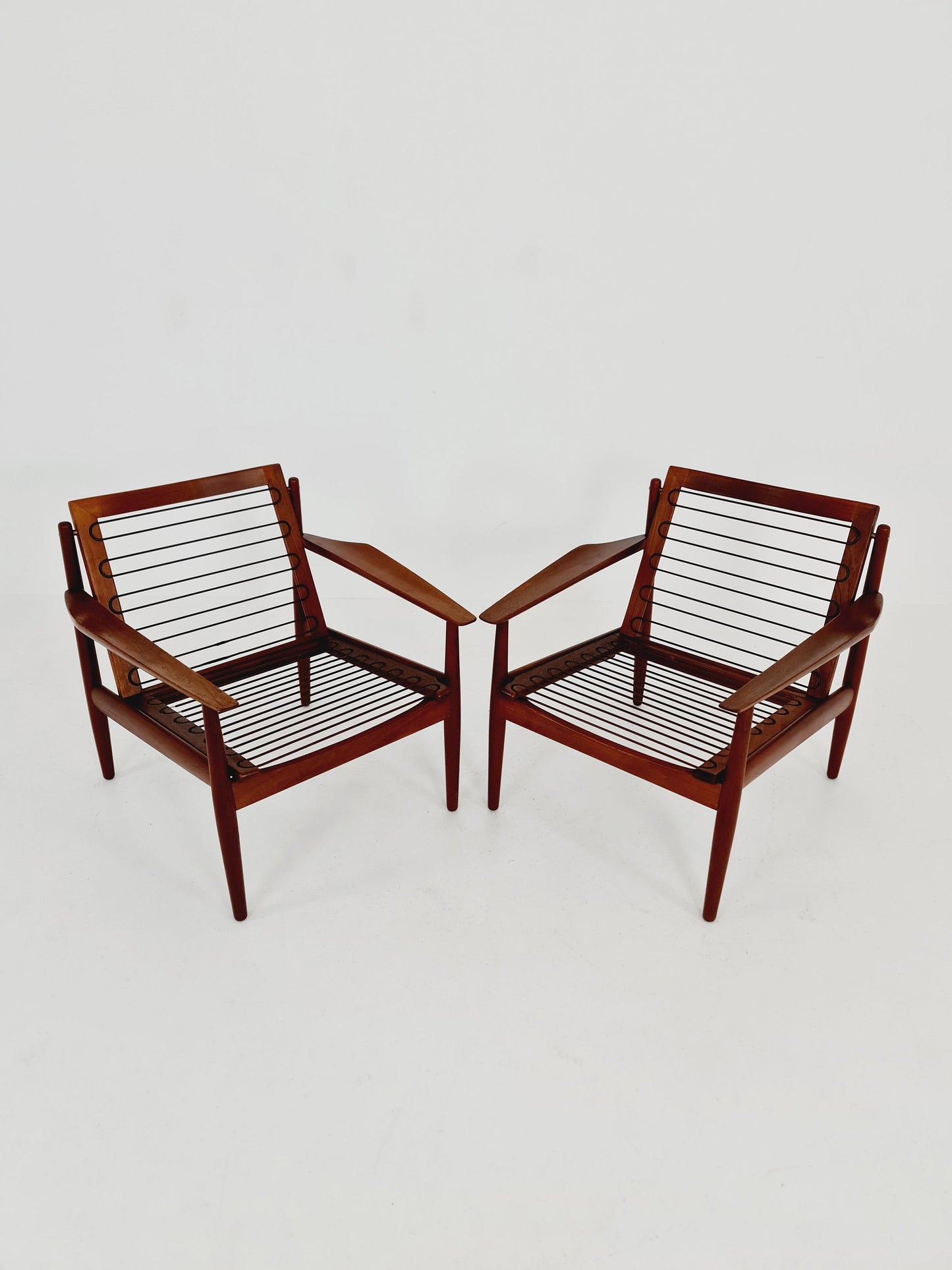 Mid century easy lounge chairs by Grete Jalk, Denmark, teak & brass, 19560s, Set of 2