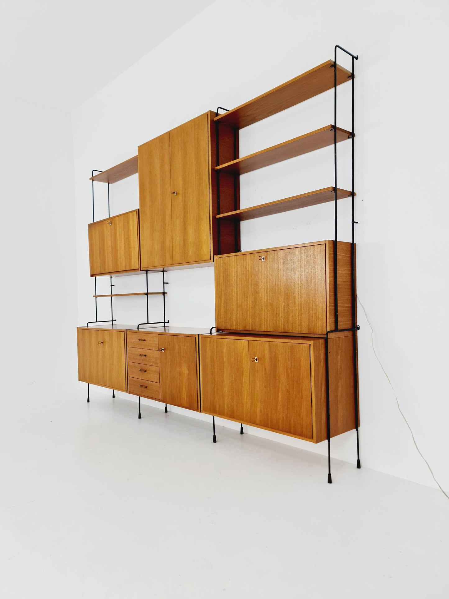 Mid century Teak 11 pieces shelving unit by Hilker for Omnia, Germany 1960s