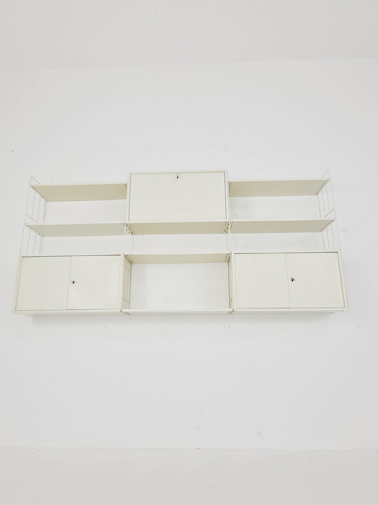 Wall-hanging String shelf-system, bookcase with bar cabinetby WHB Germany, 1950s