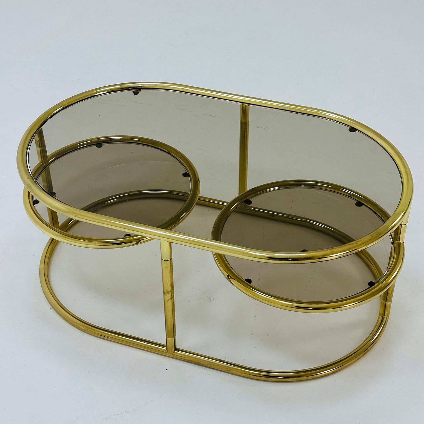 Mid century swivel coffee table brass & smoked glass ,by Milo Baughman, 1970s Italy