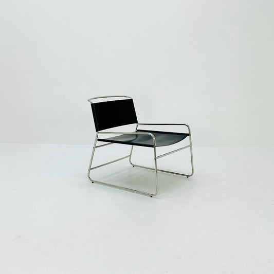 Mid century black leather lounge chair in Bauhaus style .