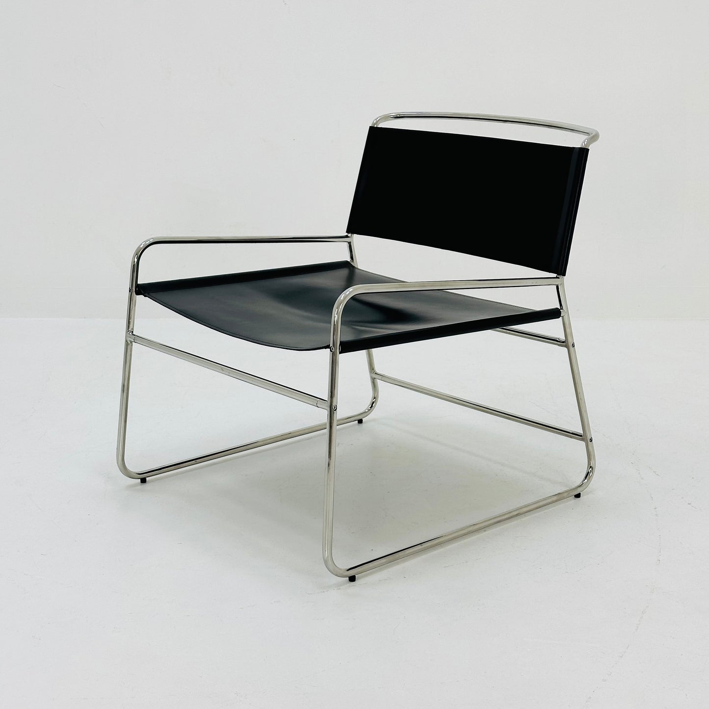 Mid century black leather lounge chair in Bauhaus style .