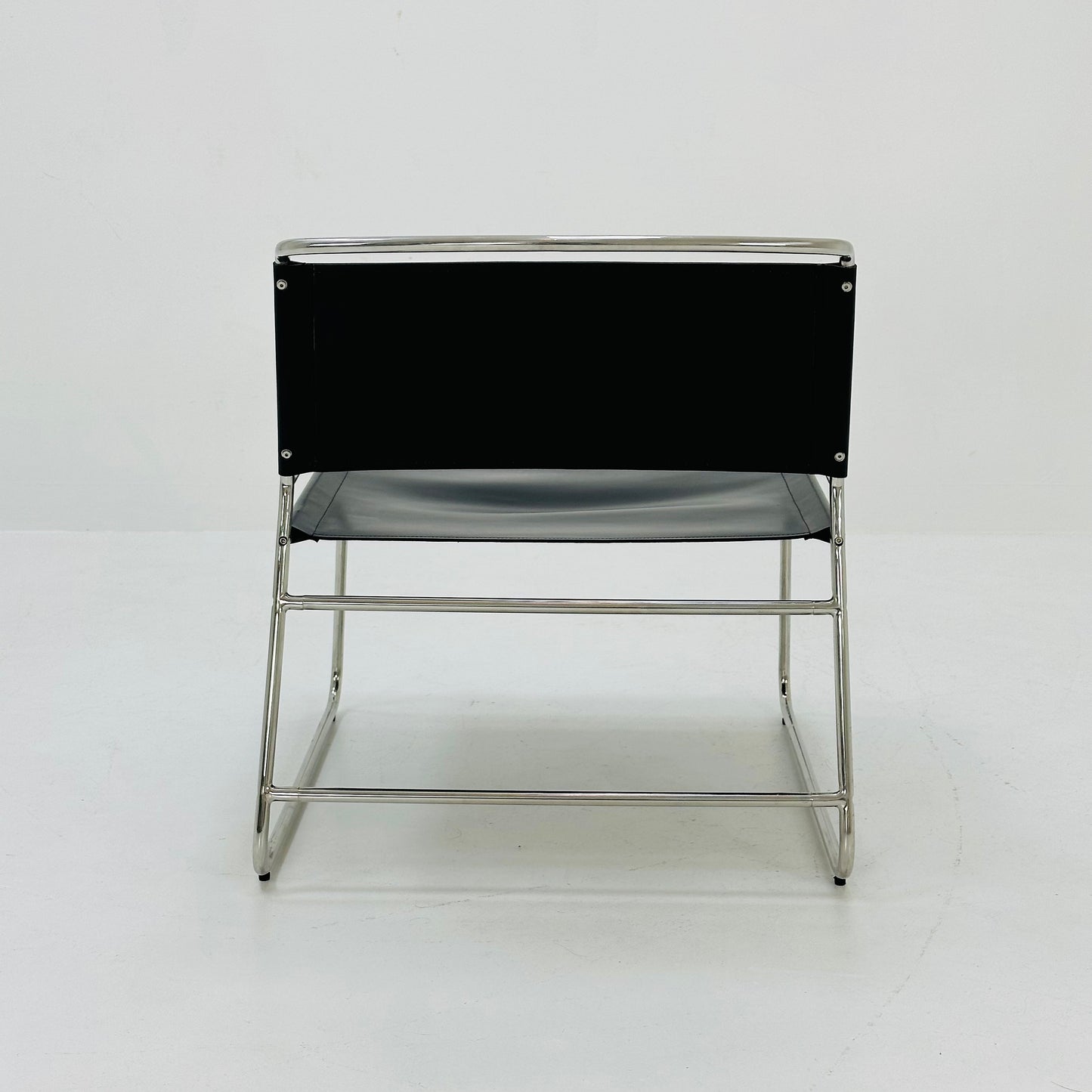 Mid century black leather lounge chair in Bauhaus style .
