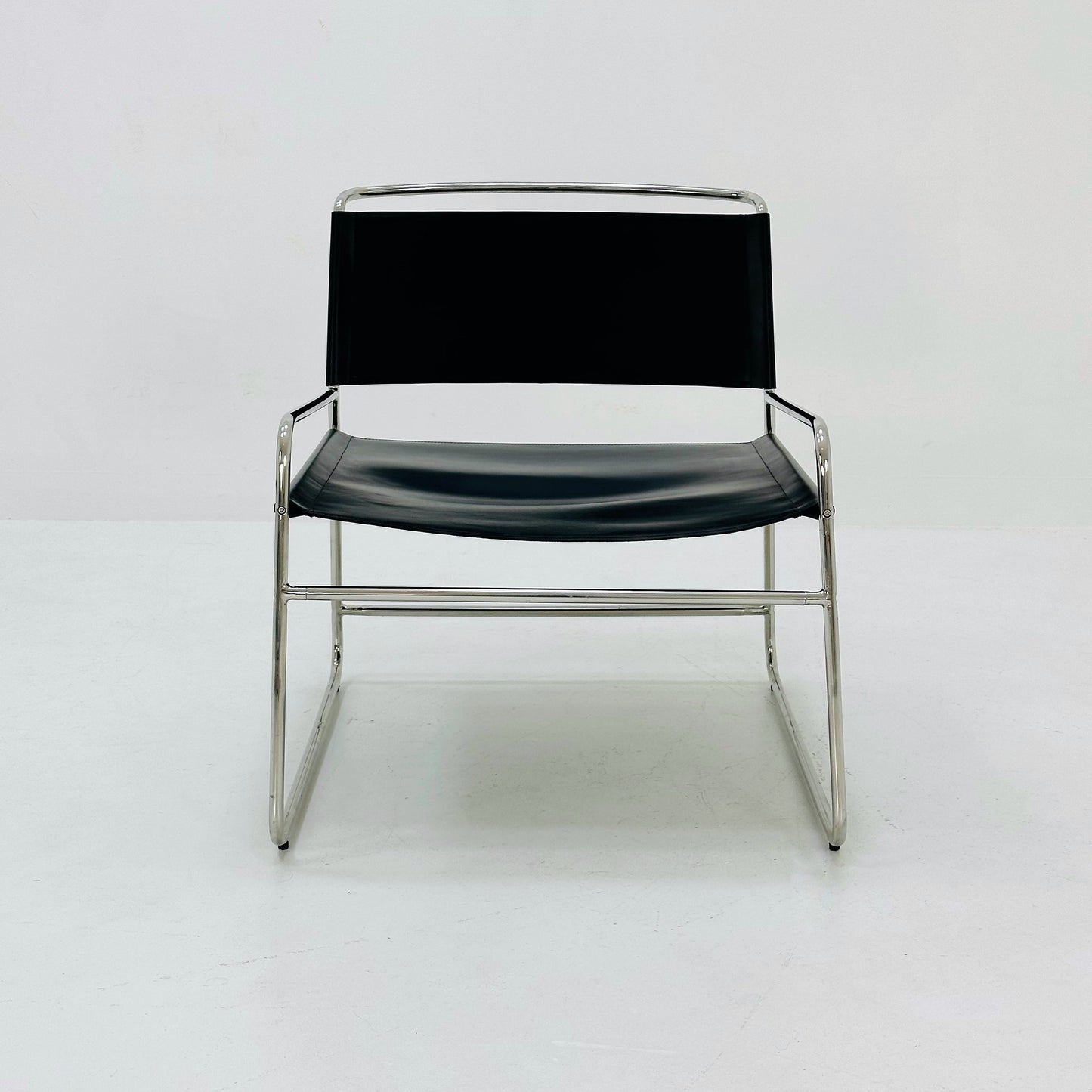 Mid century black leather lounge chair in Bauhaus style .