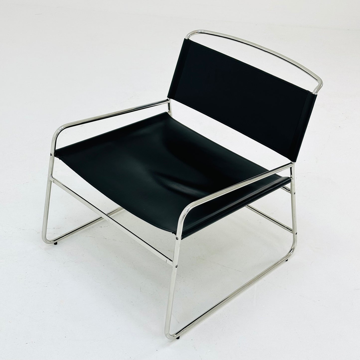 Mid century black leather lounge chair in Bauhaus style .