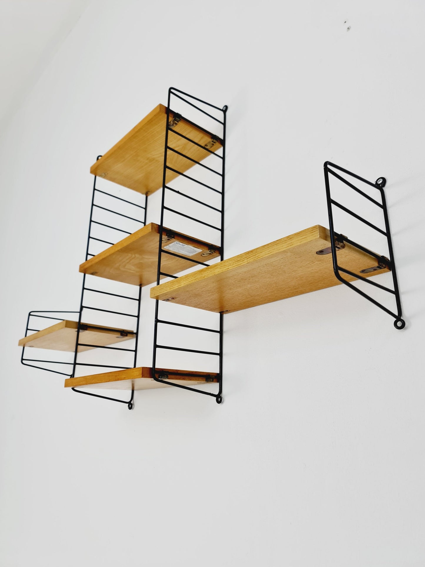 Original MCM Oak shelving system - consists of Black lacquered metal ladders, from string Stockholm 1960s
