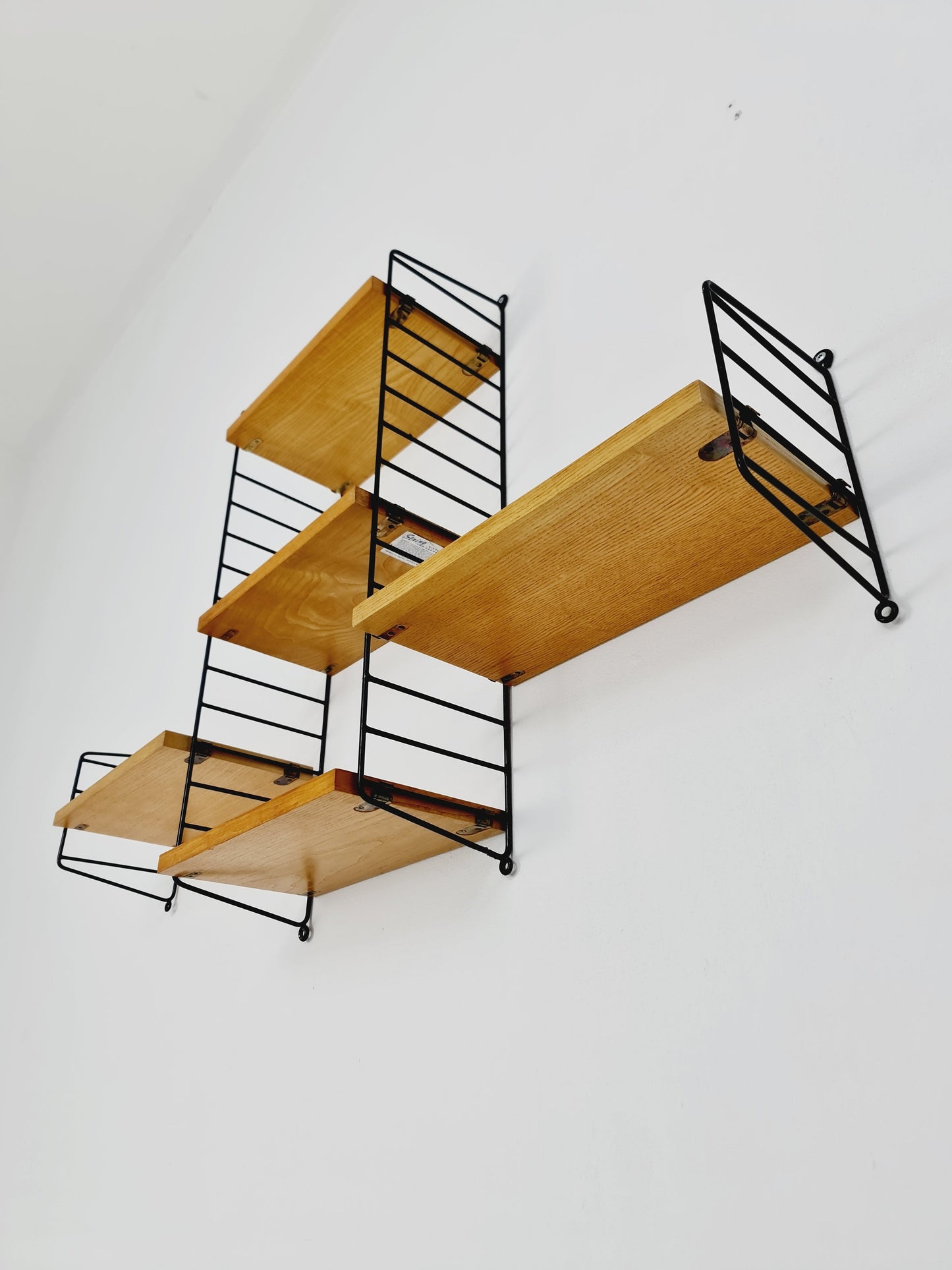 Original MCM Oak shelving system - consists of Black lacquered metal ladders, from string Stockholm 1960s