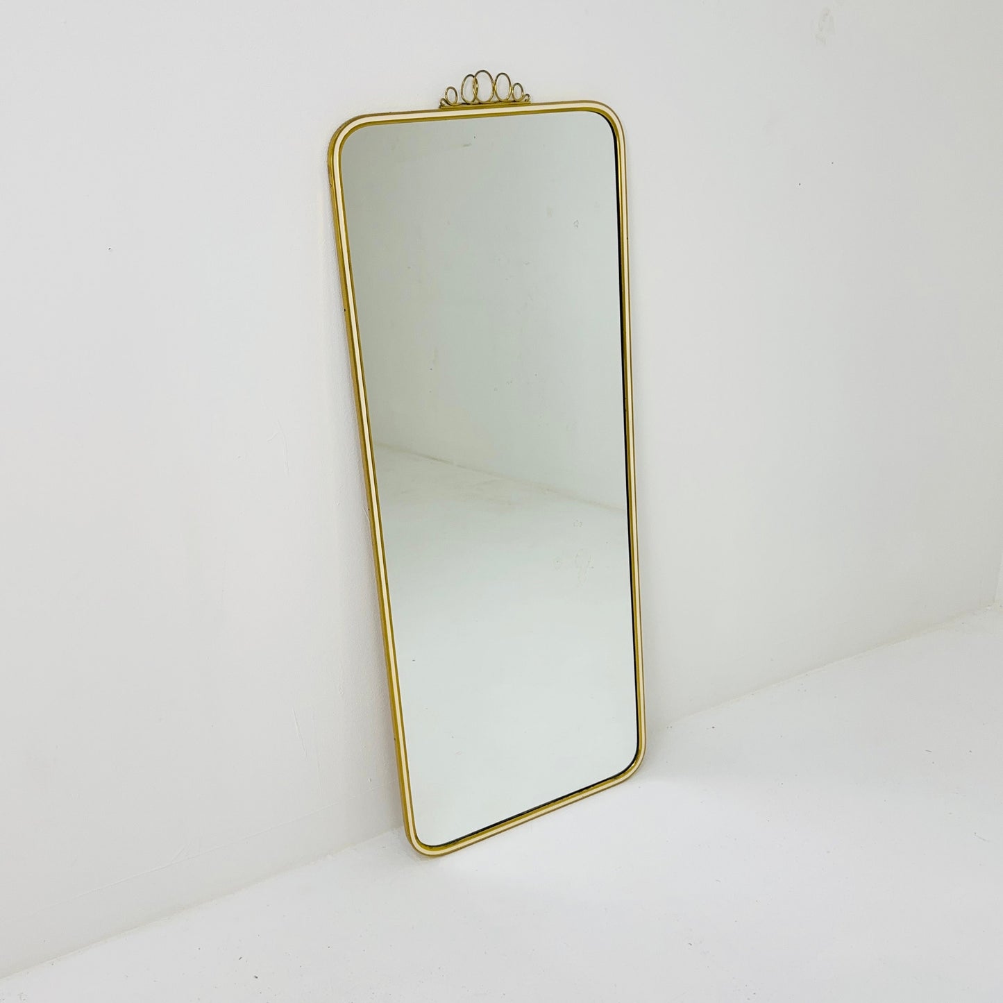Mid century brass wall mirror with decorative bow 1950s, Italy