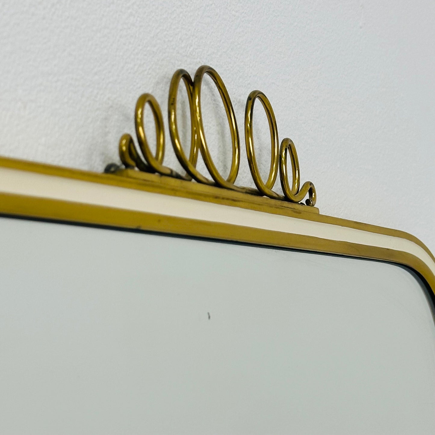 Mid century brass wall mirror with decorative bow 1950s, Italy