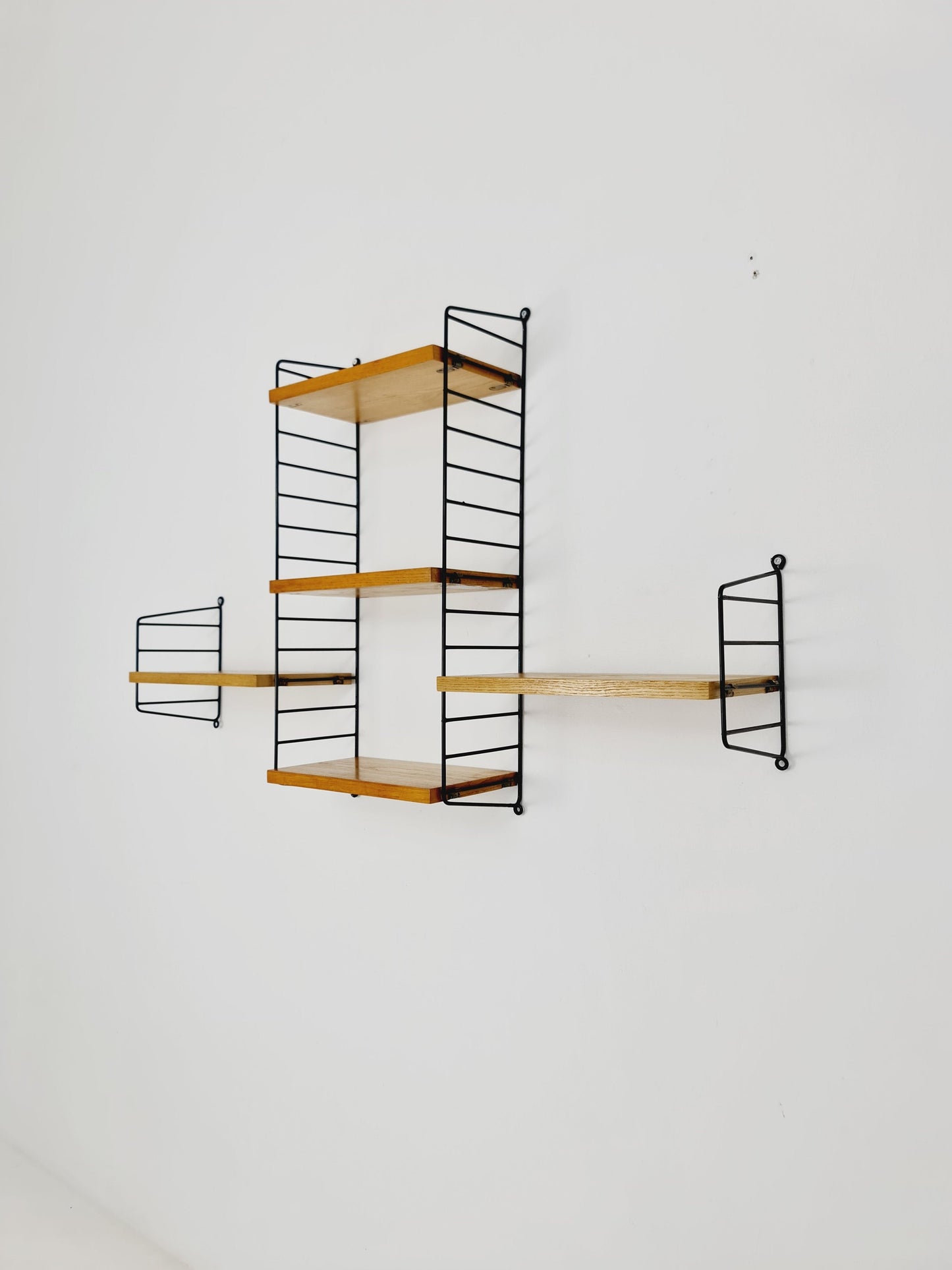 Original MCM Oak shelving system - consists of Black lacquered metal ladders, from string Stockholm 1960s