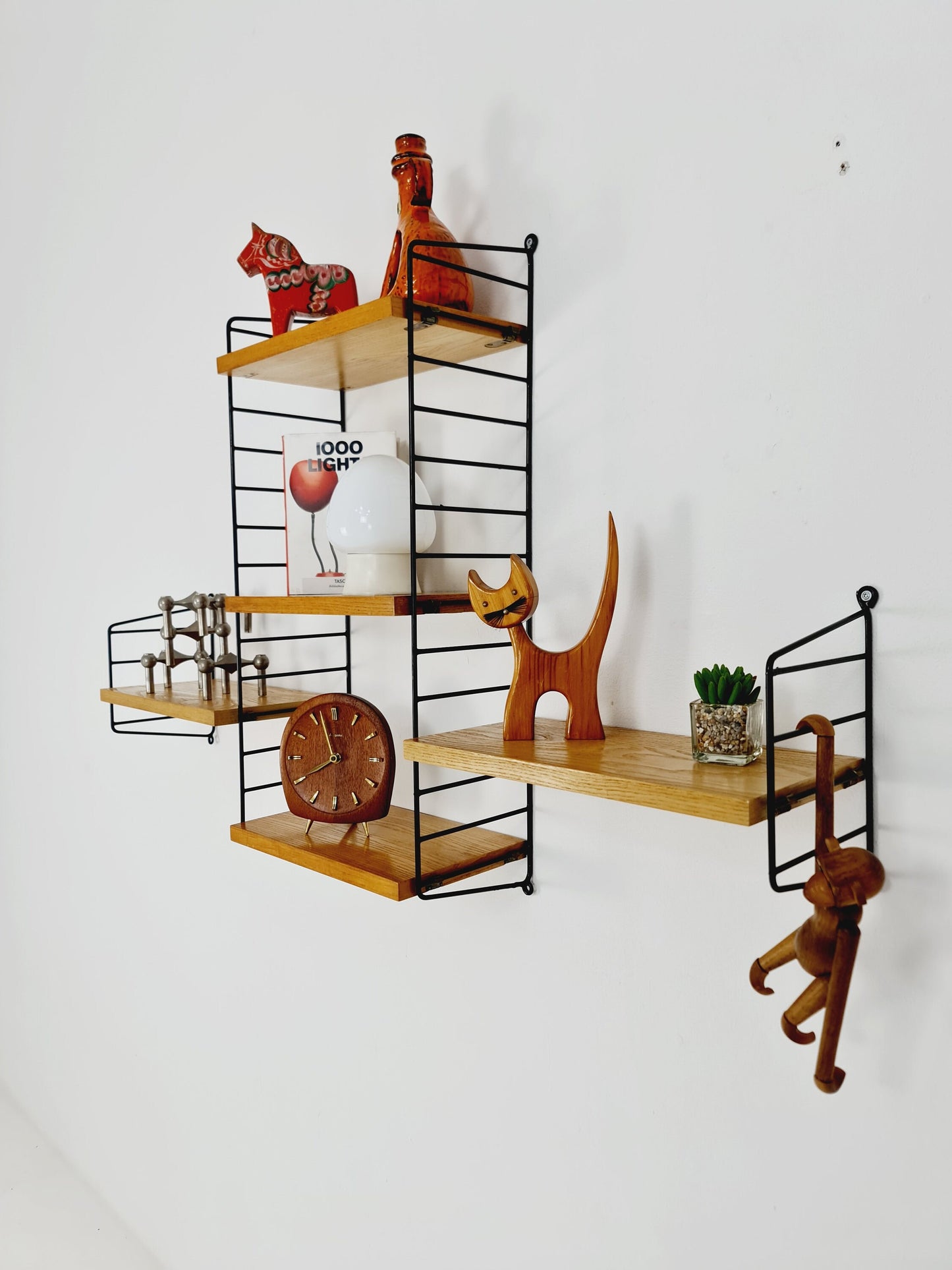 Original MCM Oak shelving system - consists of Black lacquered metal ladders, from string Stockholm 1960s