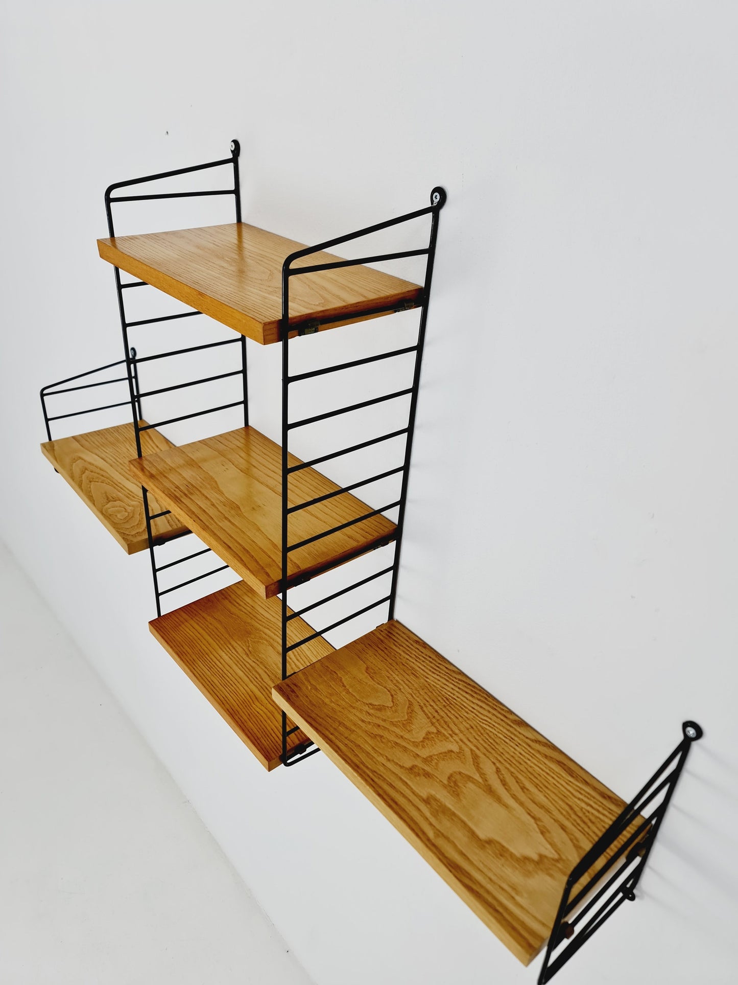 Original MCM Oak shelving system - consists of Black lacquered metal ladders, from string Stockholm 1960s