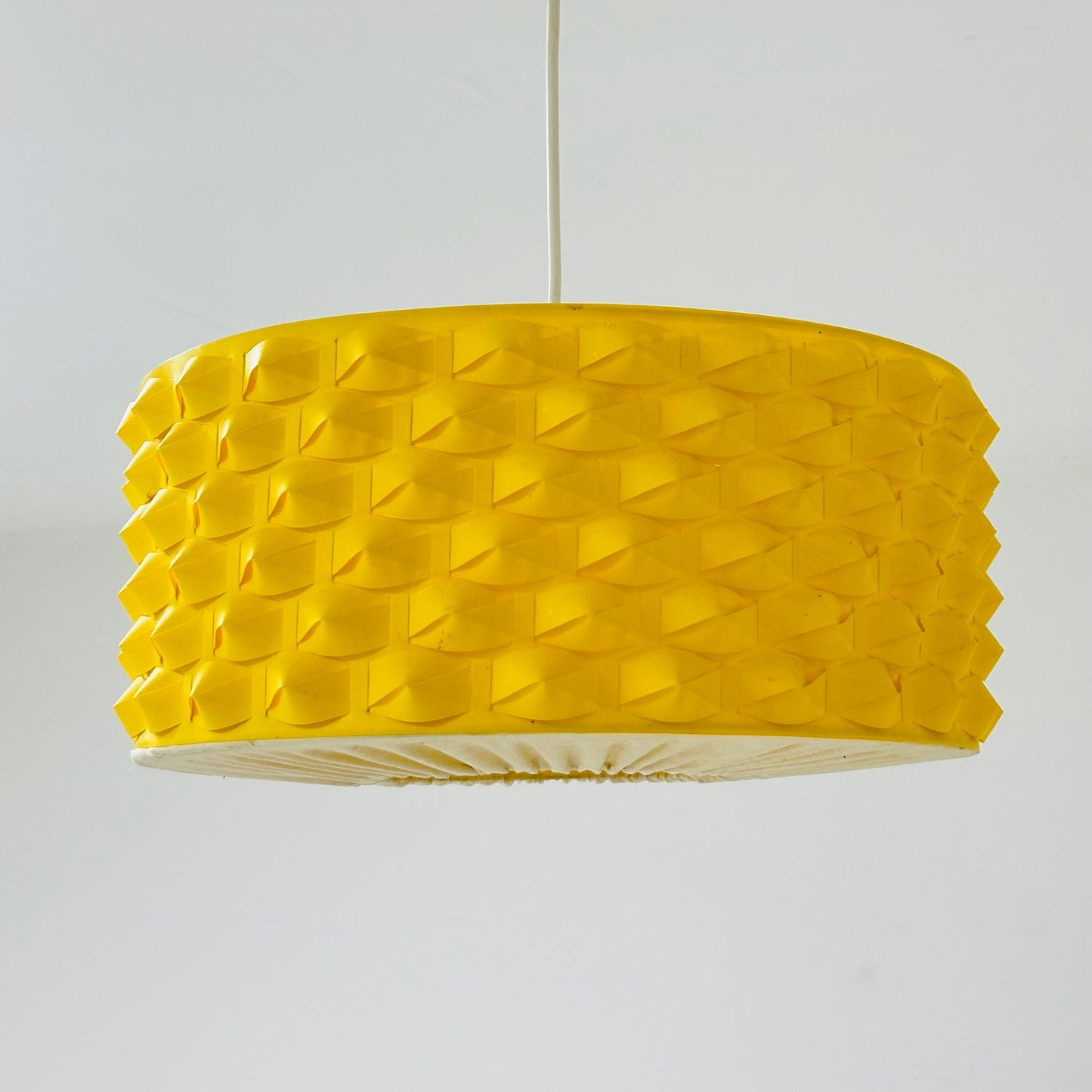 Rare Space age yellow plastic pendant lamp with fabric details 1970s
