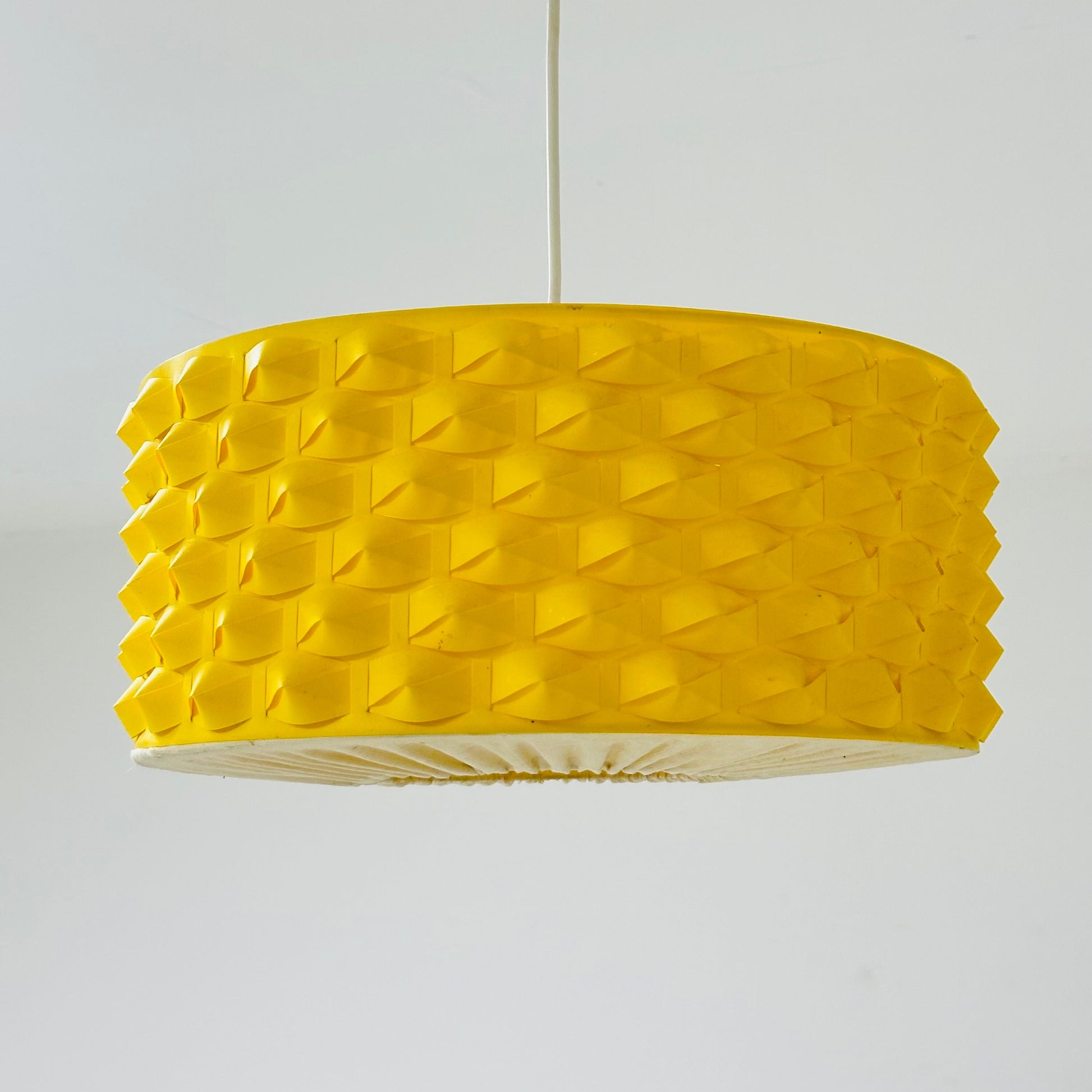Rare Space age yellow plastic pendant lamp with fabric details 1970s