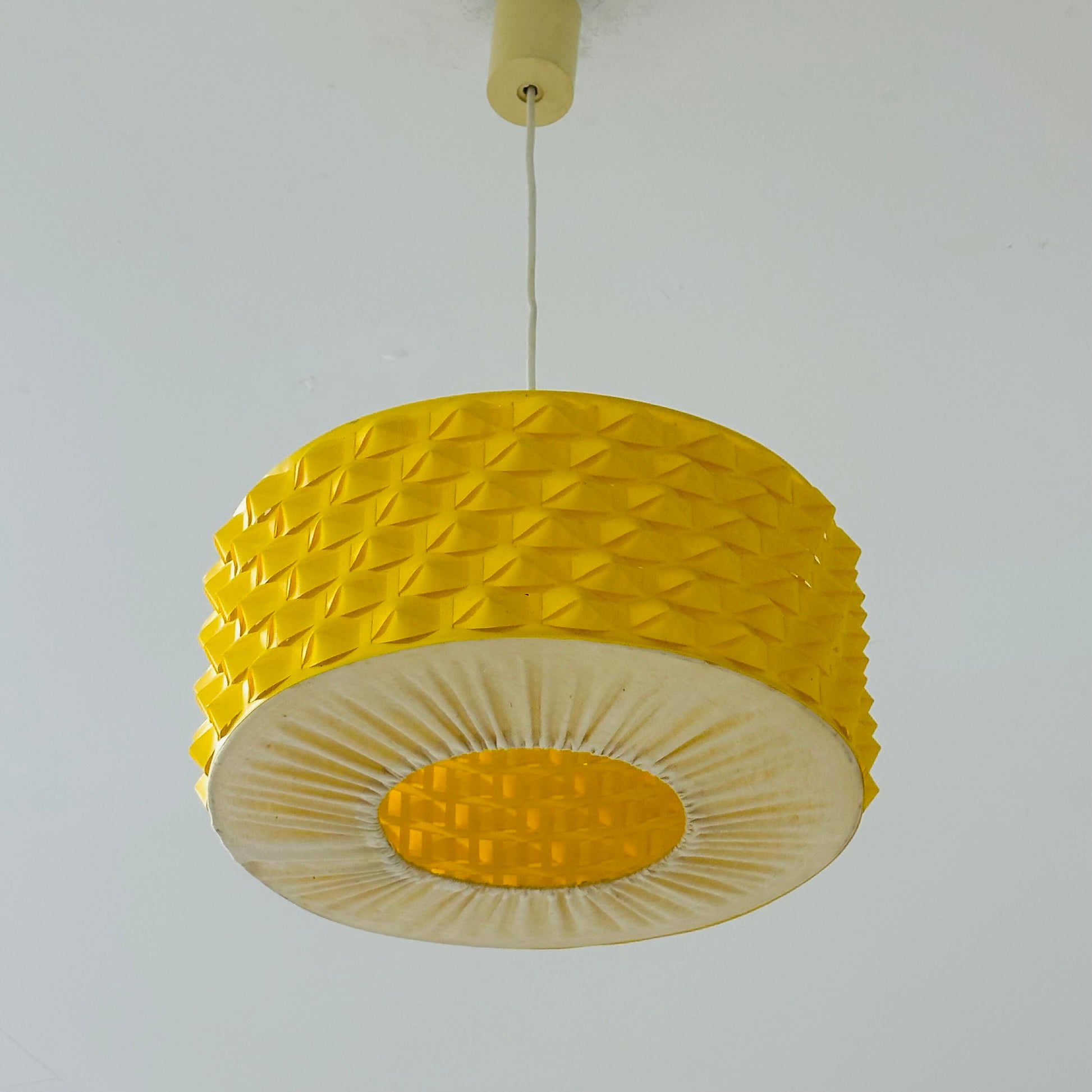 Rare Space age yellow plastic pendant lamp with fabric details 1970s
