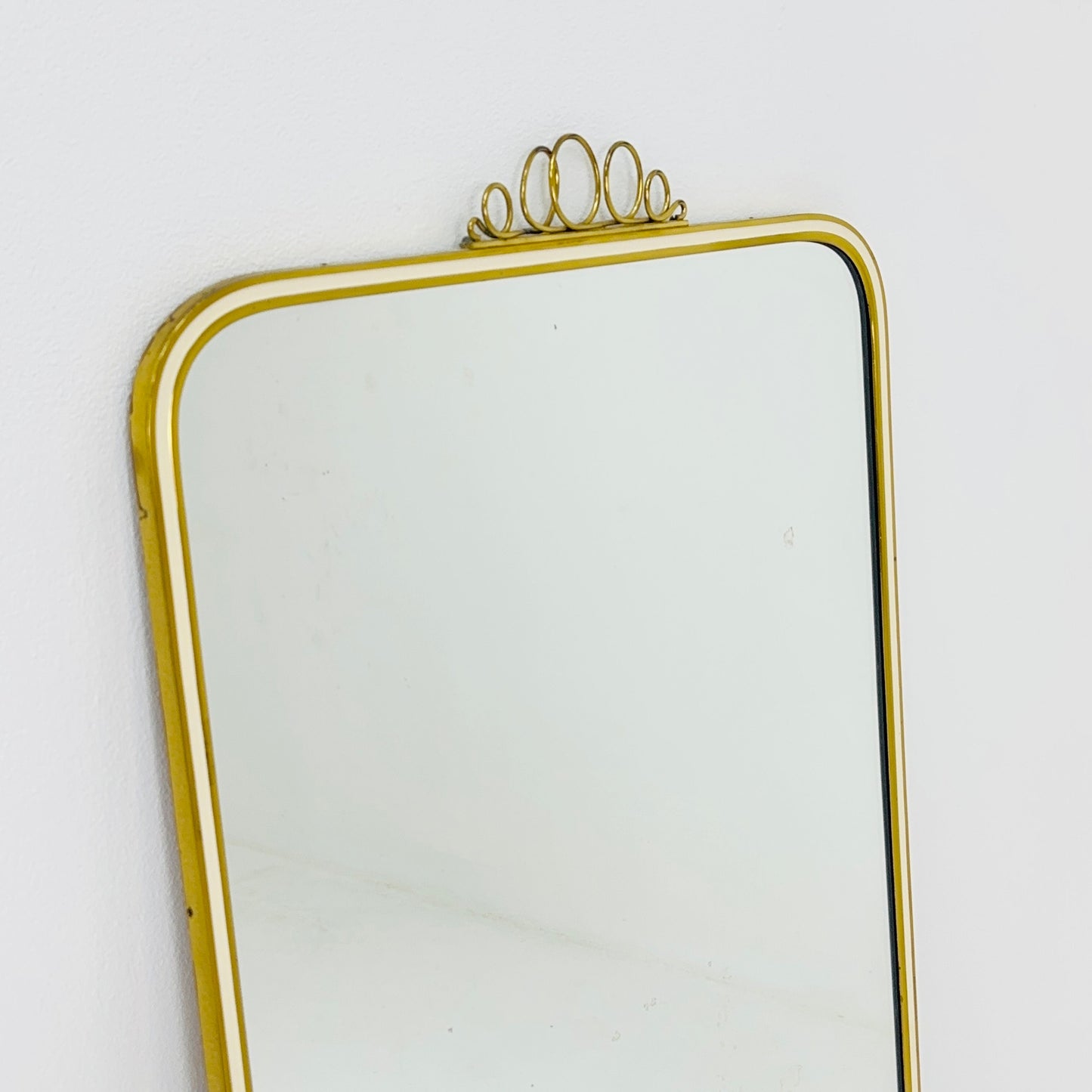 Mid century brass wall mirror with decorative bow 1950s, Italy
