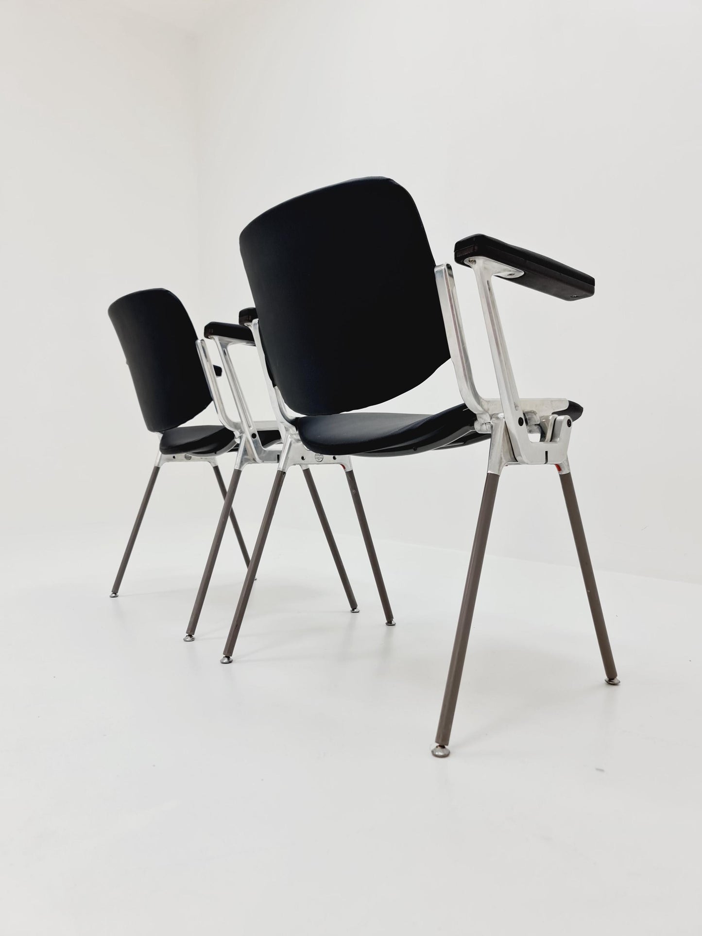 1 / 2 Italian black leatherite Castelli arm chairs by Giancarlo Piretti, 1970s
