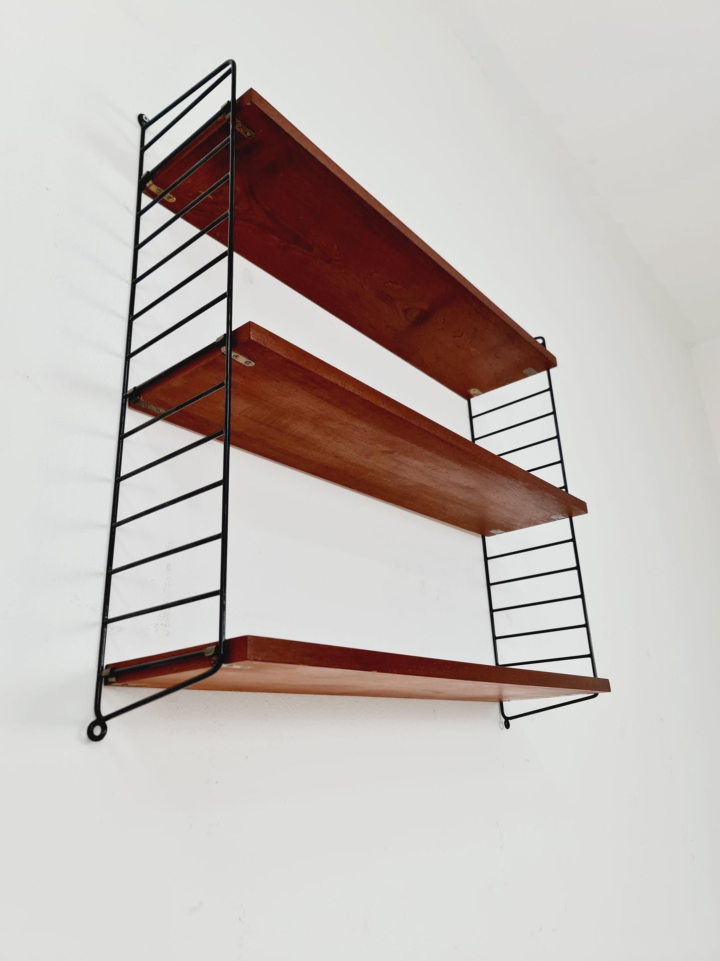 Original MCM Teak shelving system - consists of black lacquered metal ladders, from string Stockholm 1960s