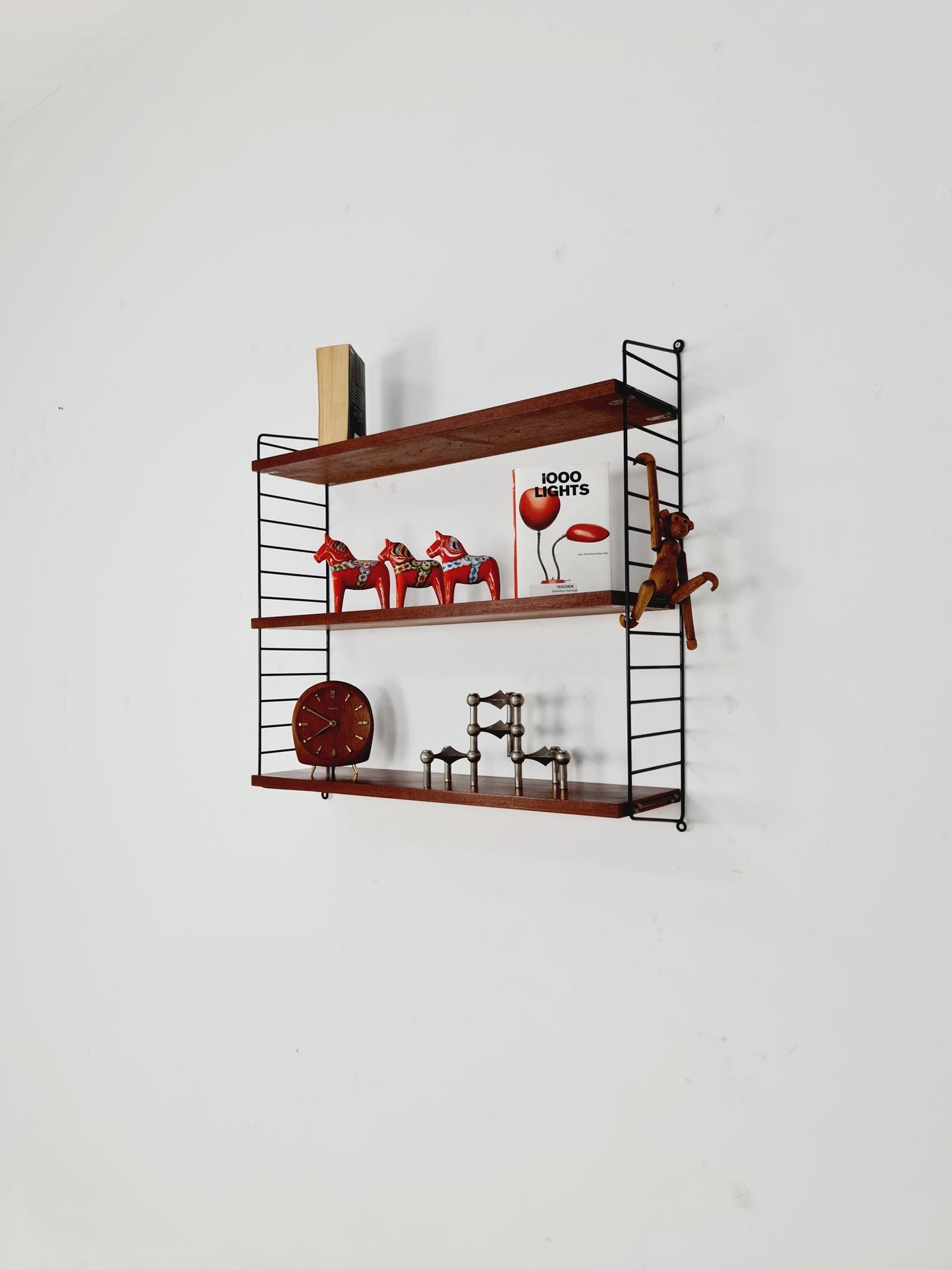 Original MCM Teak shelving system - consists of black lacquered metal ladders, from string Stockholm 1960s