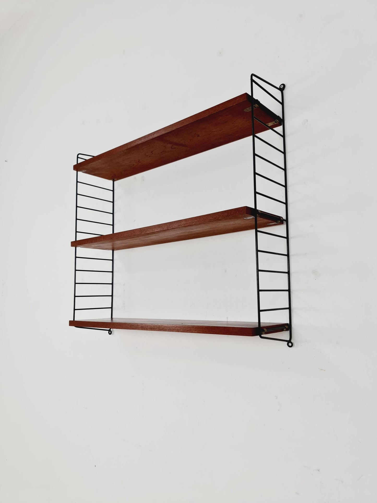Original MCM Teak shelving system - consists of black lacquered metal ladders, from string Stockholm 1960s