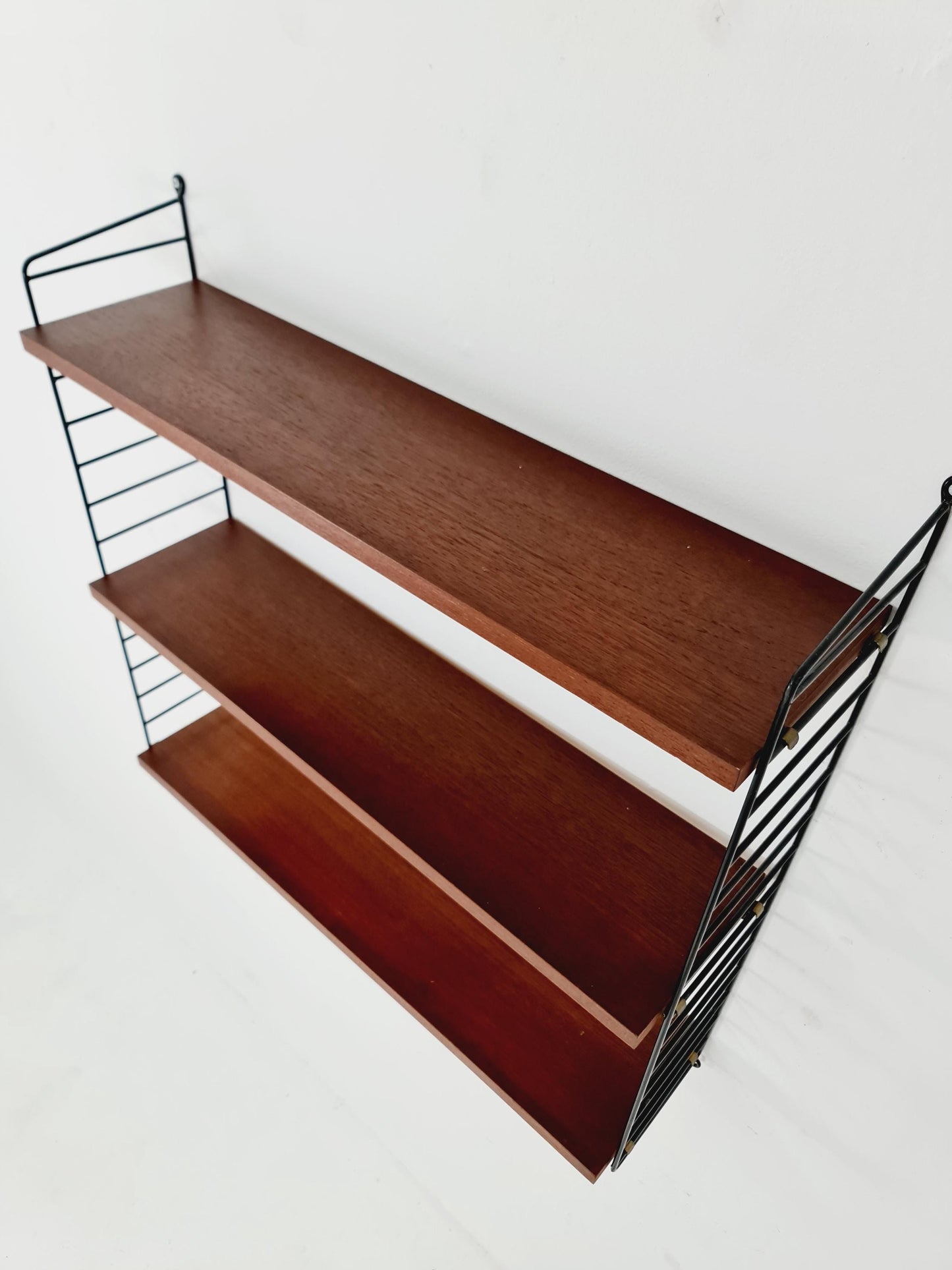 Original MCM Teak shelving system - consists of black lacquered metal ladders, from string Stockholm 1960s