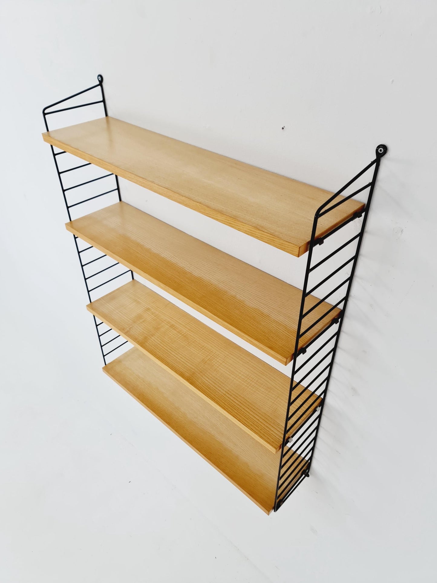 Original MCM Ash shelving system - consists of Black lacquered metal ladders, from string Stockholm 1960s