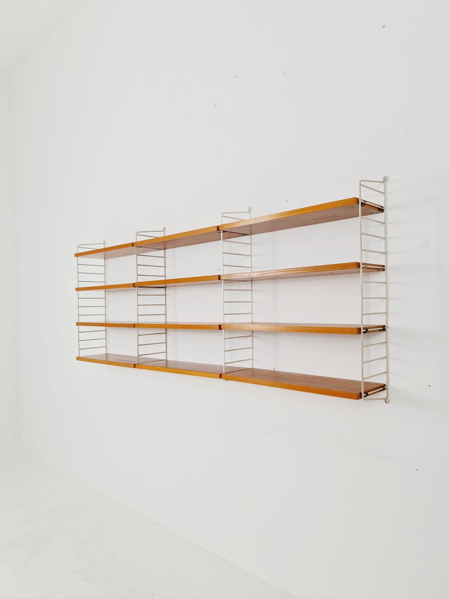 Original MCM Ash shelving system - consists of Black lacquered metal ladders, from string Stockholm 1960s