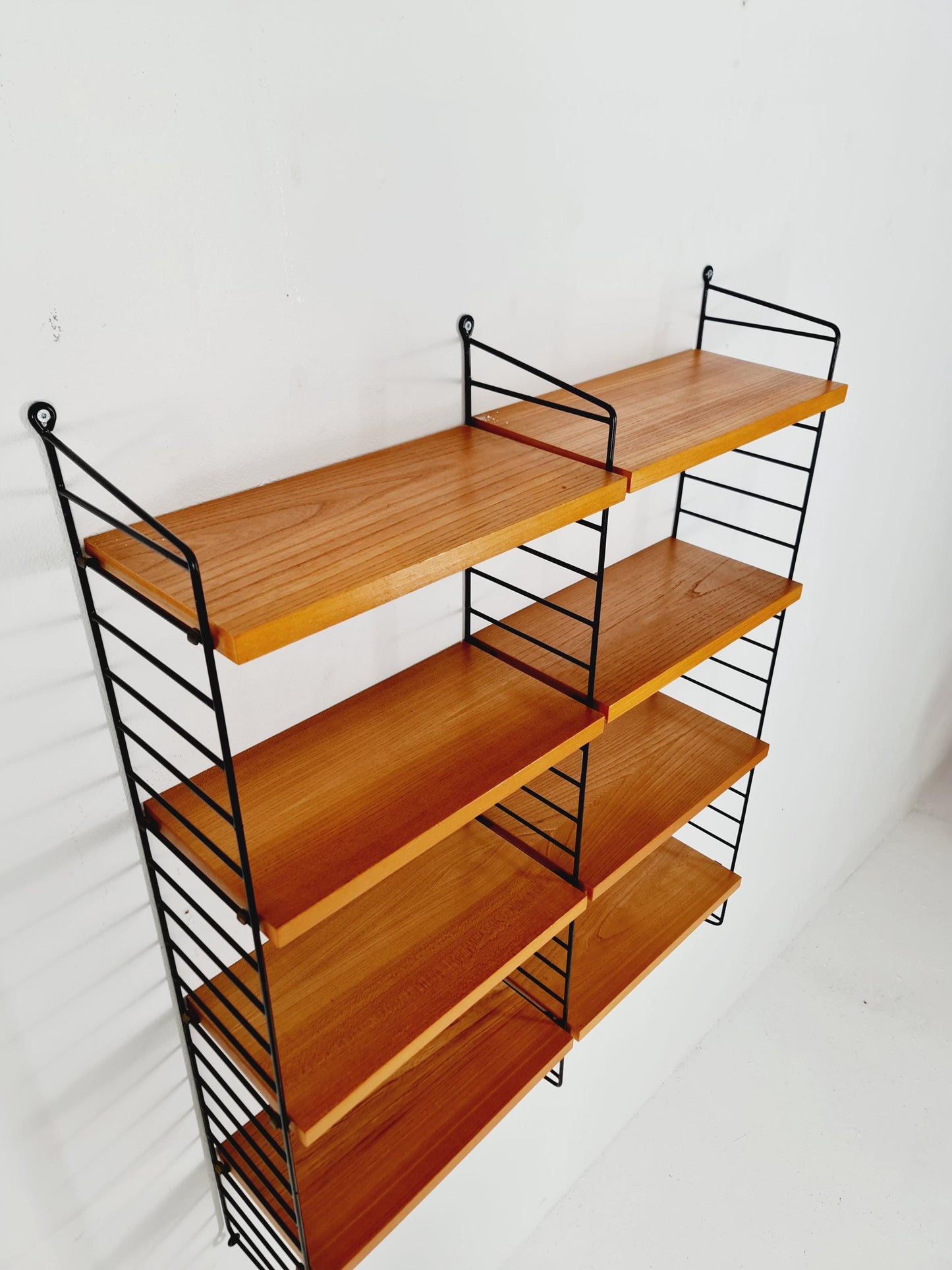 Original MCM Ash shelving system - consists of black lacquered metal ladders, from string Stockholm 1960s