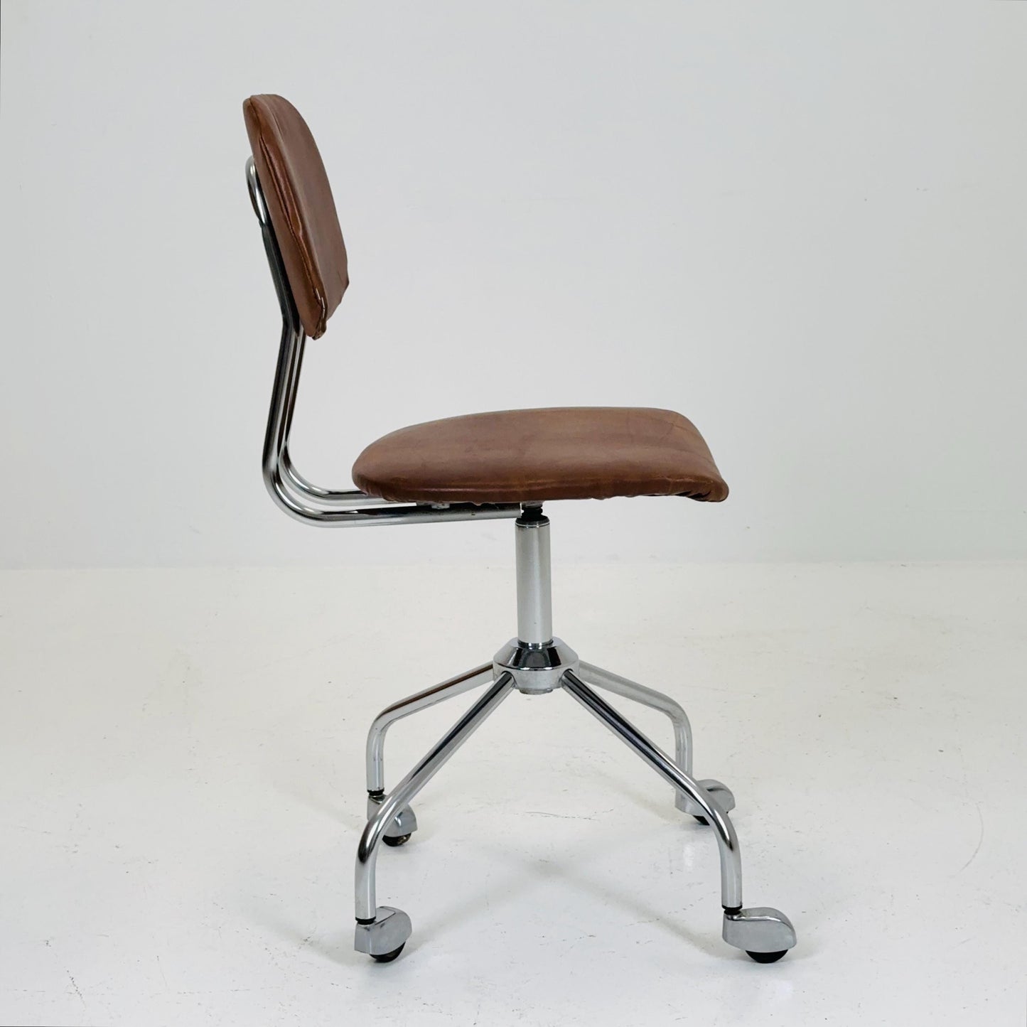 Vintage office/desk chair in brown leather with swivel steel structure Italy 1960s