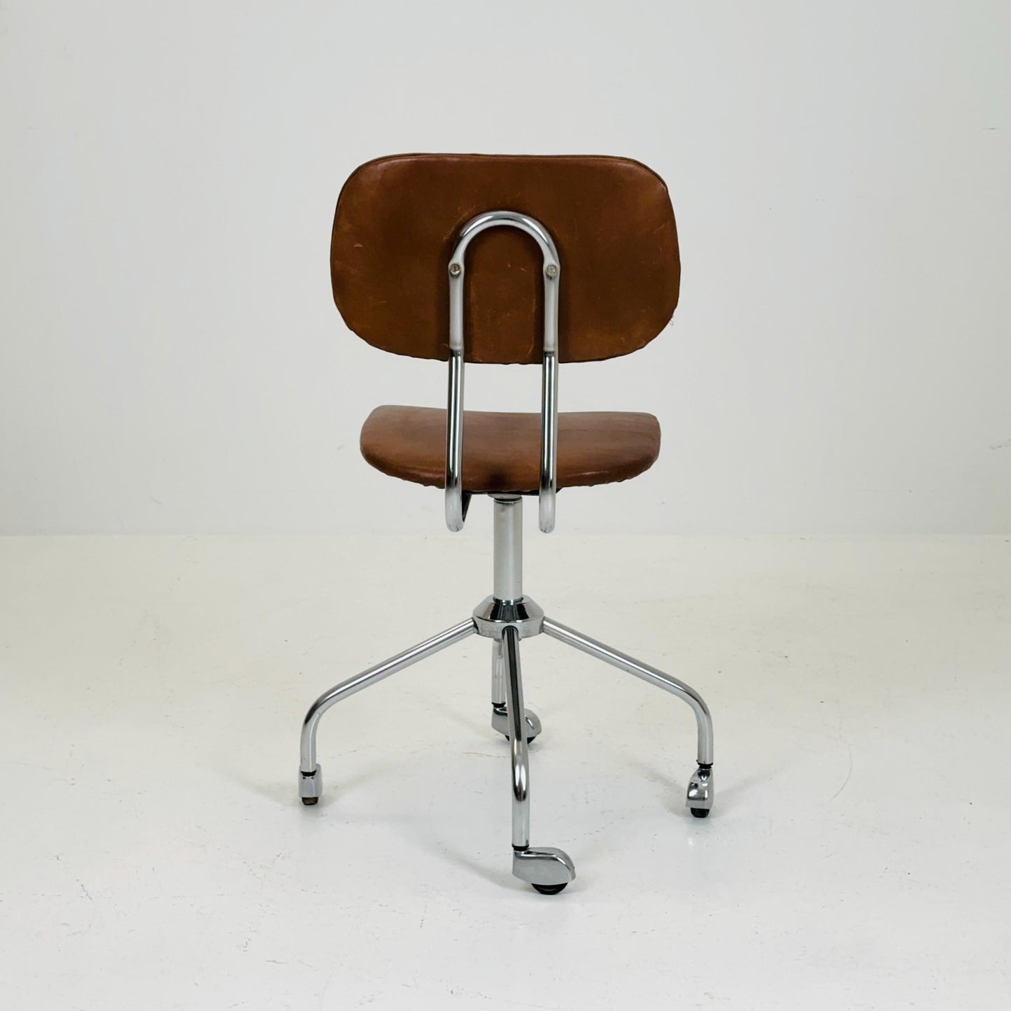 Vintage office/desk chair in brown leather with swivel steel structure Italy 1960s