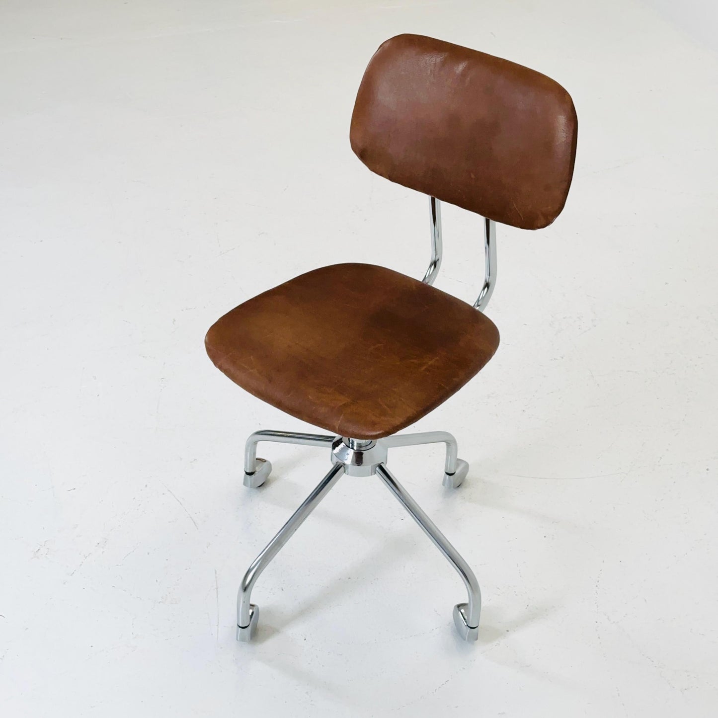 Vintage office/desk chair in brown leather with swivel steel structure Italy 1960s