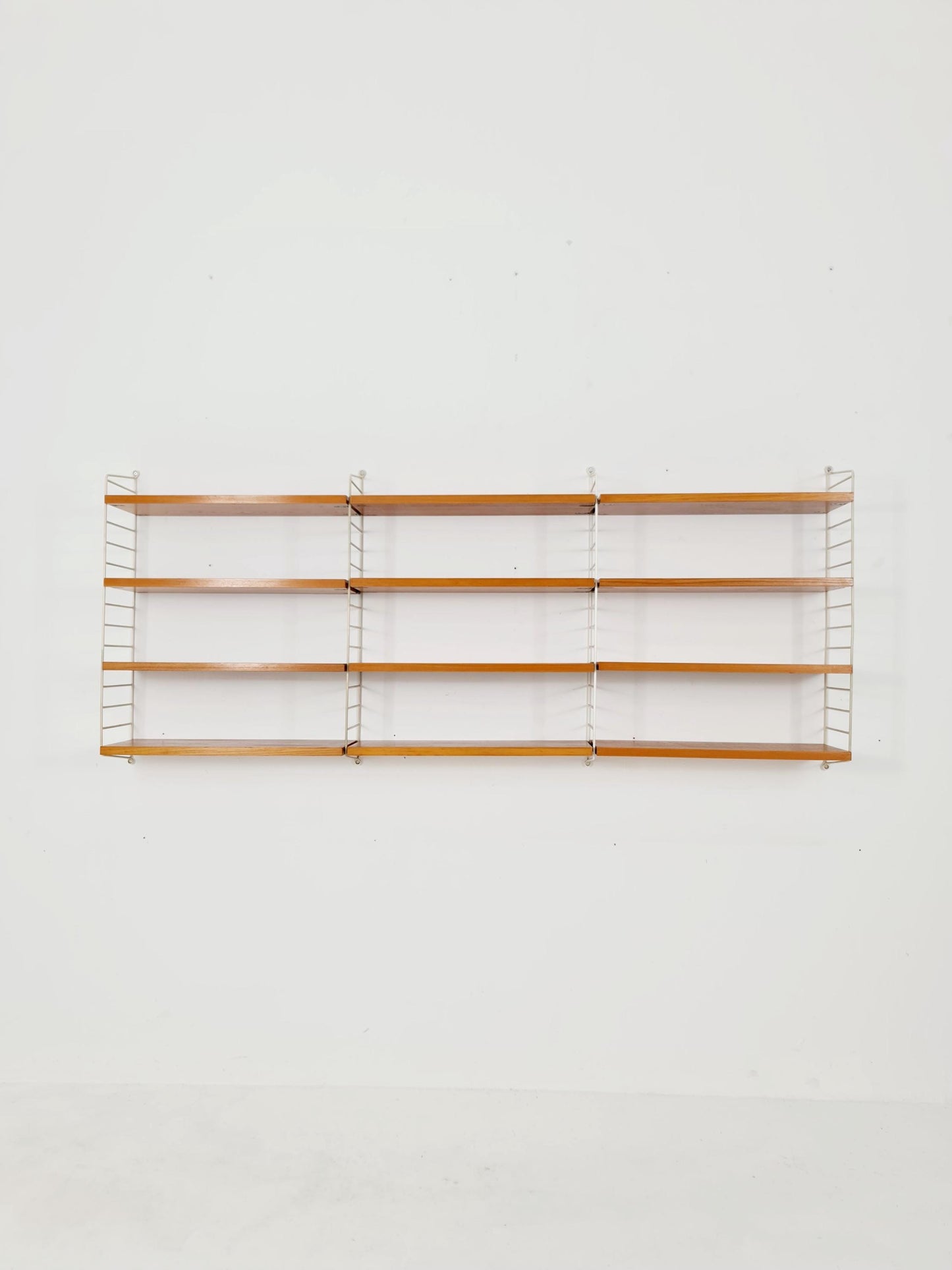 Original MCM Ash shelving system - consists of Black lacquered metal ladders, from string Stockholm 1960s