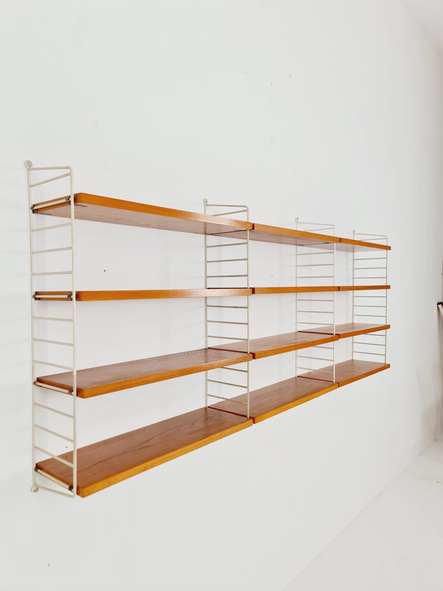 Original MCM Ash shelving system - consists of Black lacquered metal ladders, from string Stockholm 1960s