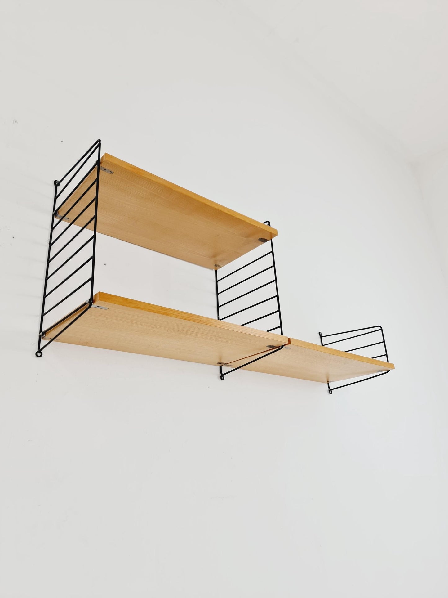 Original MCM Ash shelving system - consists of Black lacquered metal ladders, from string Stockholm 1960s