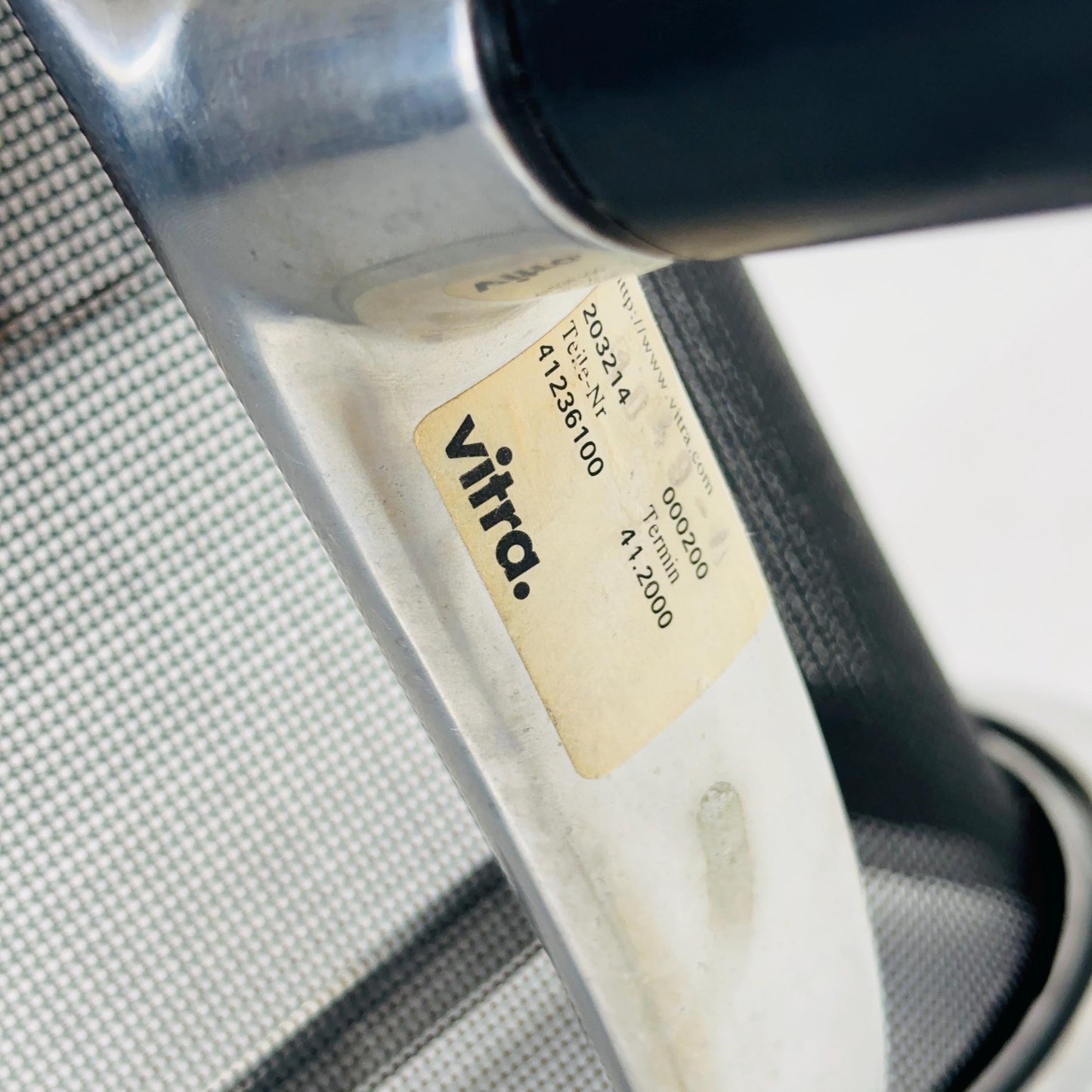 Mid century Eames EA 108 office chair by Vitra with black mesh and polished aluminum 1960s