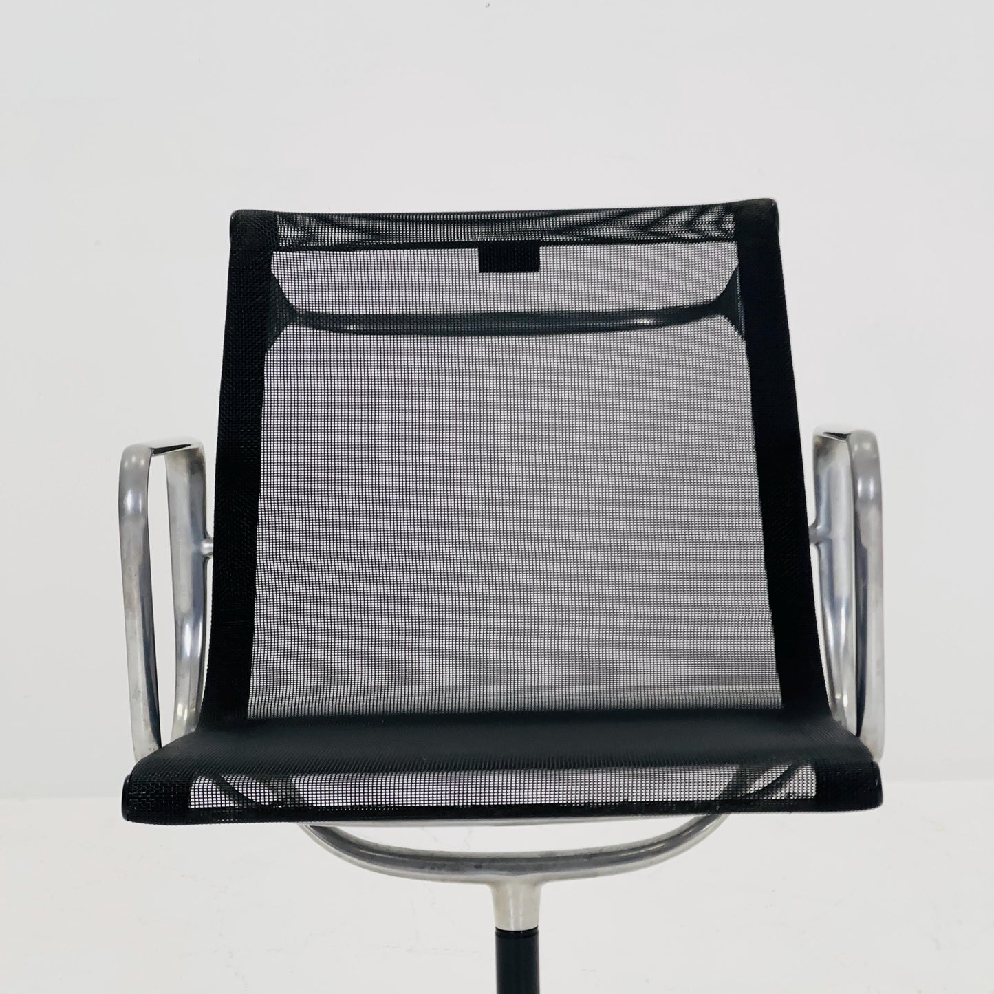 Mid century Eames EA 108 office chair by Vitra with black mesh and polished aluminum 1960s