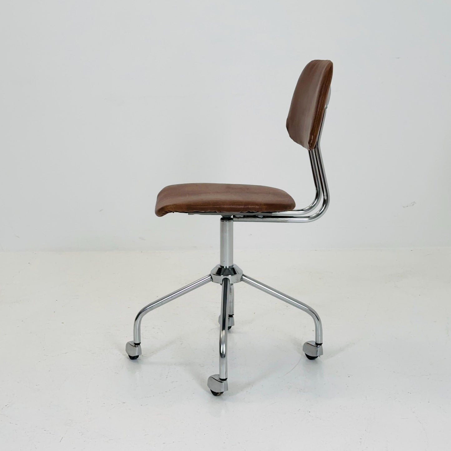 Vintage office/desk chair in brown leather with swivel steel structure Italy 1960s